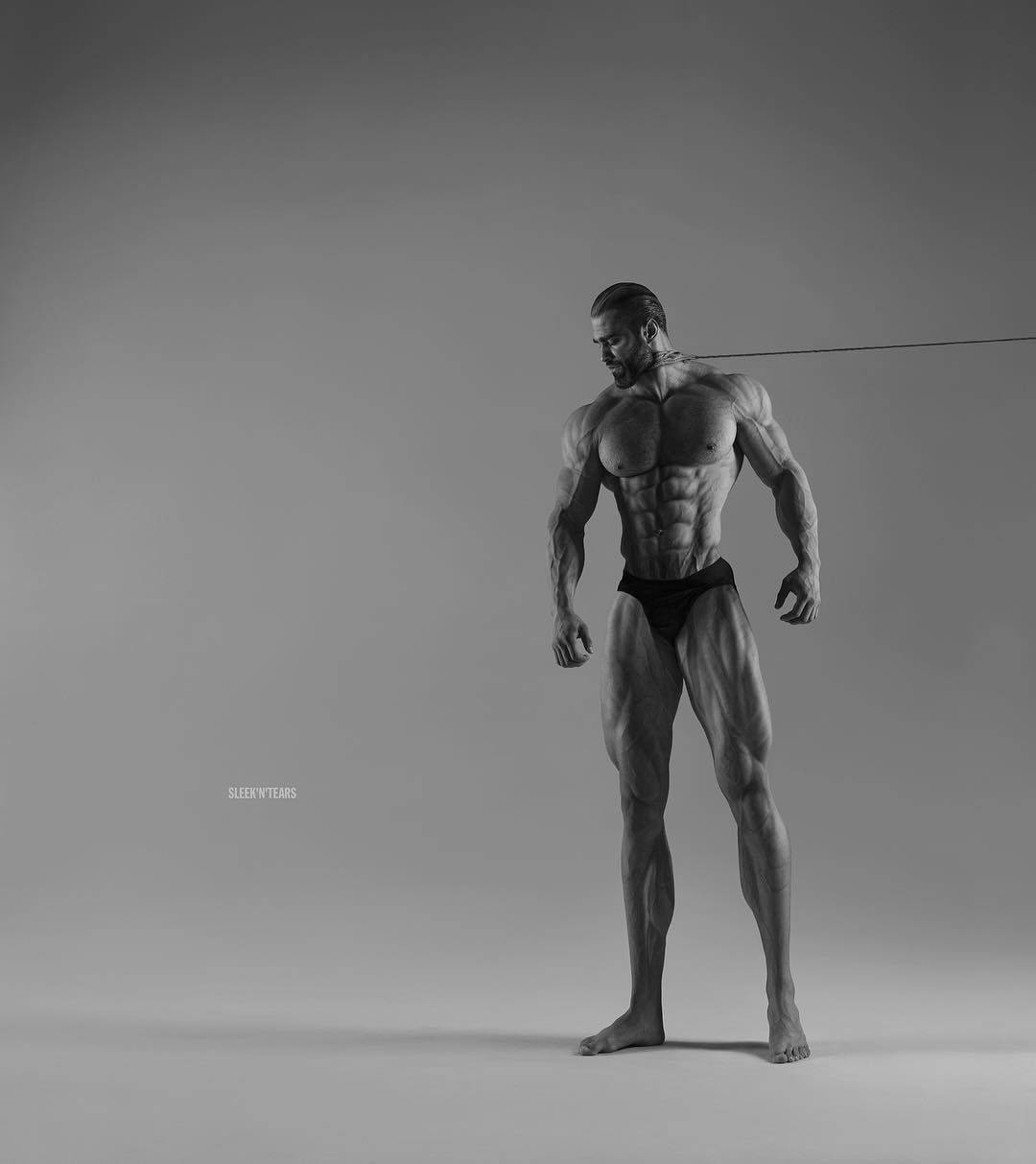 Download Muscular Model Giga Chad Posing Confidently Wallpaper | Wallpapers.com