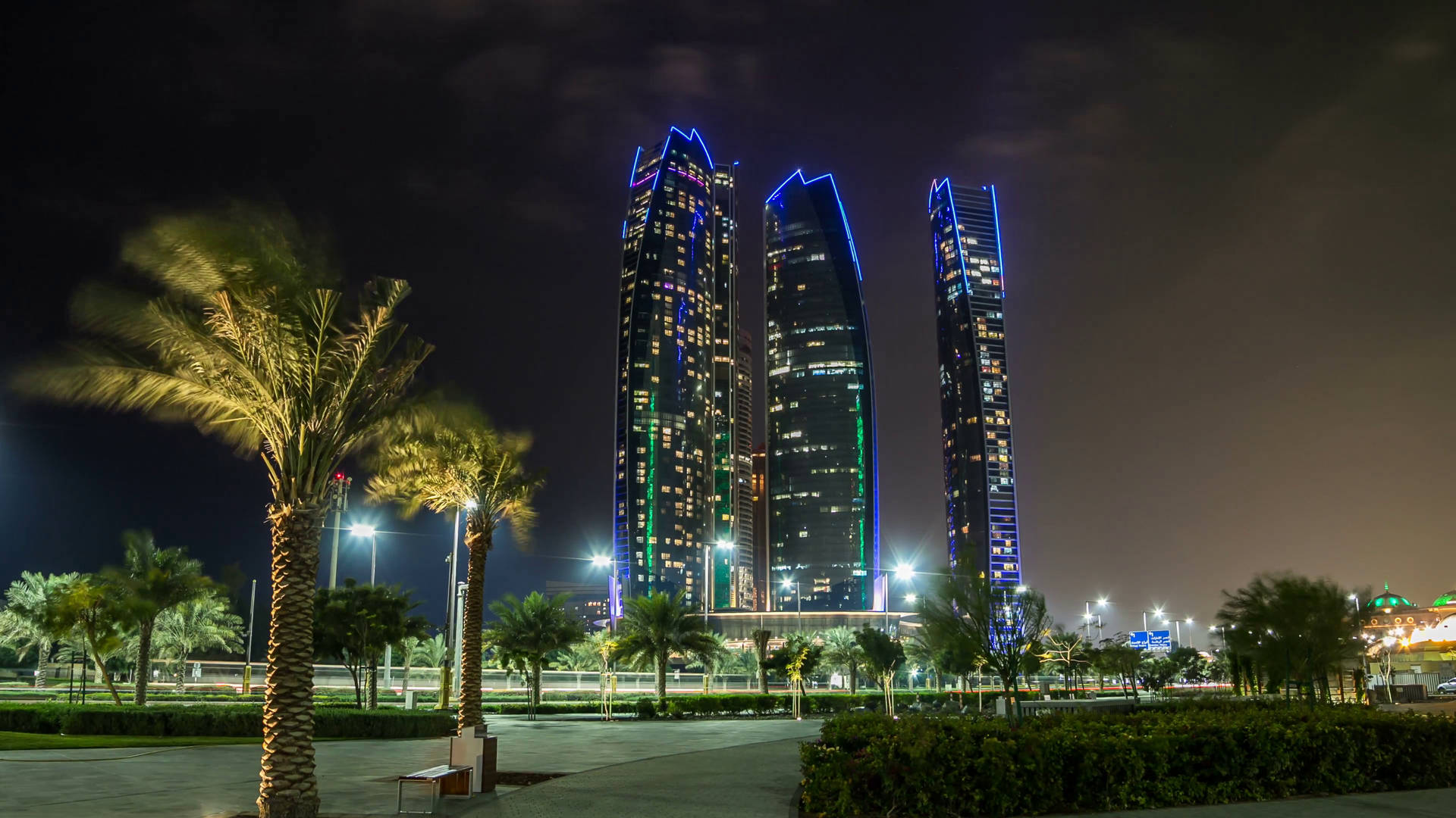 United Arab Emirates Etihad Towers At Night Background