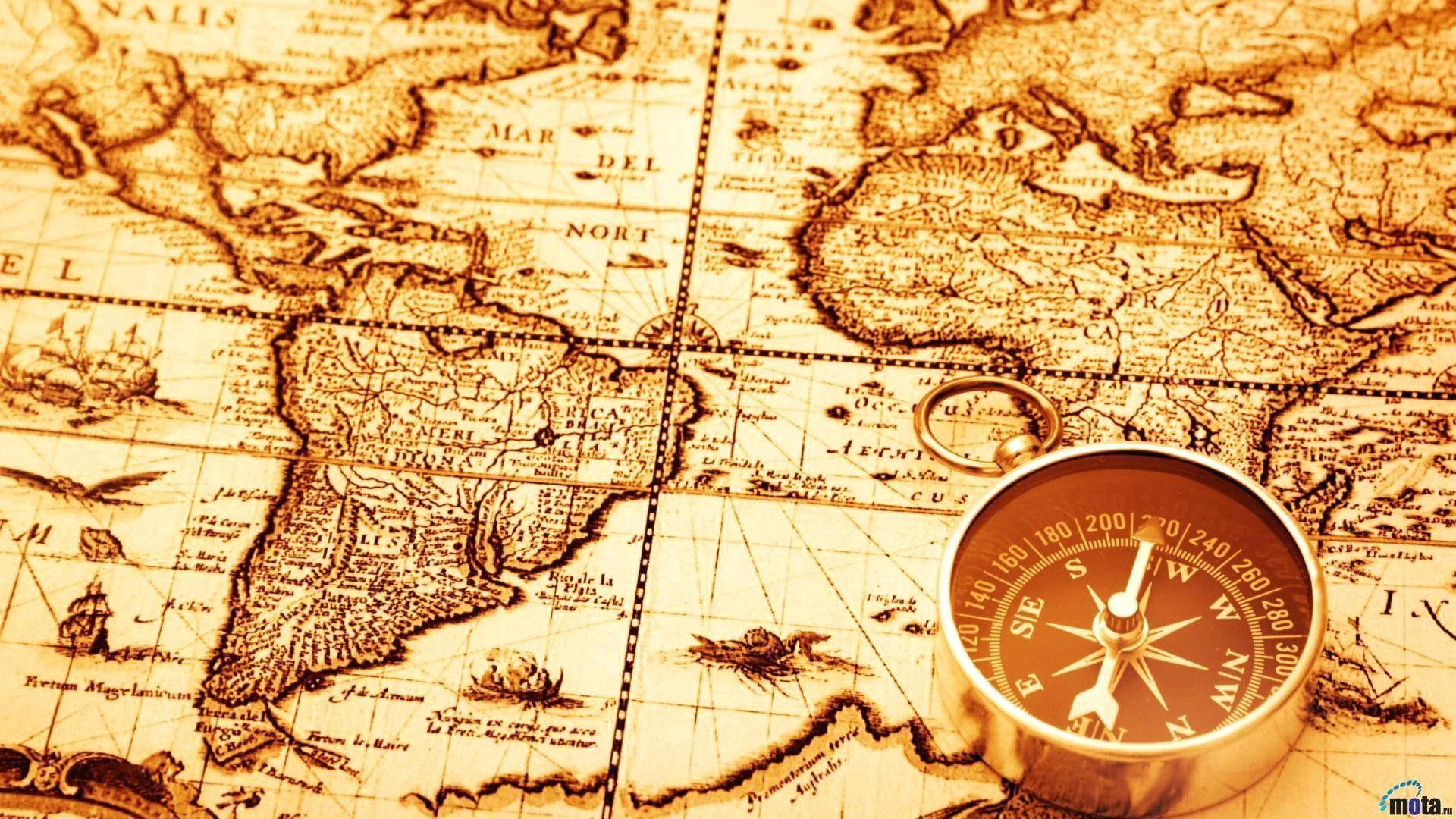 En Kompass På En Gammal Världskarta. Wallpaper