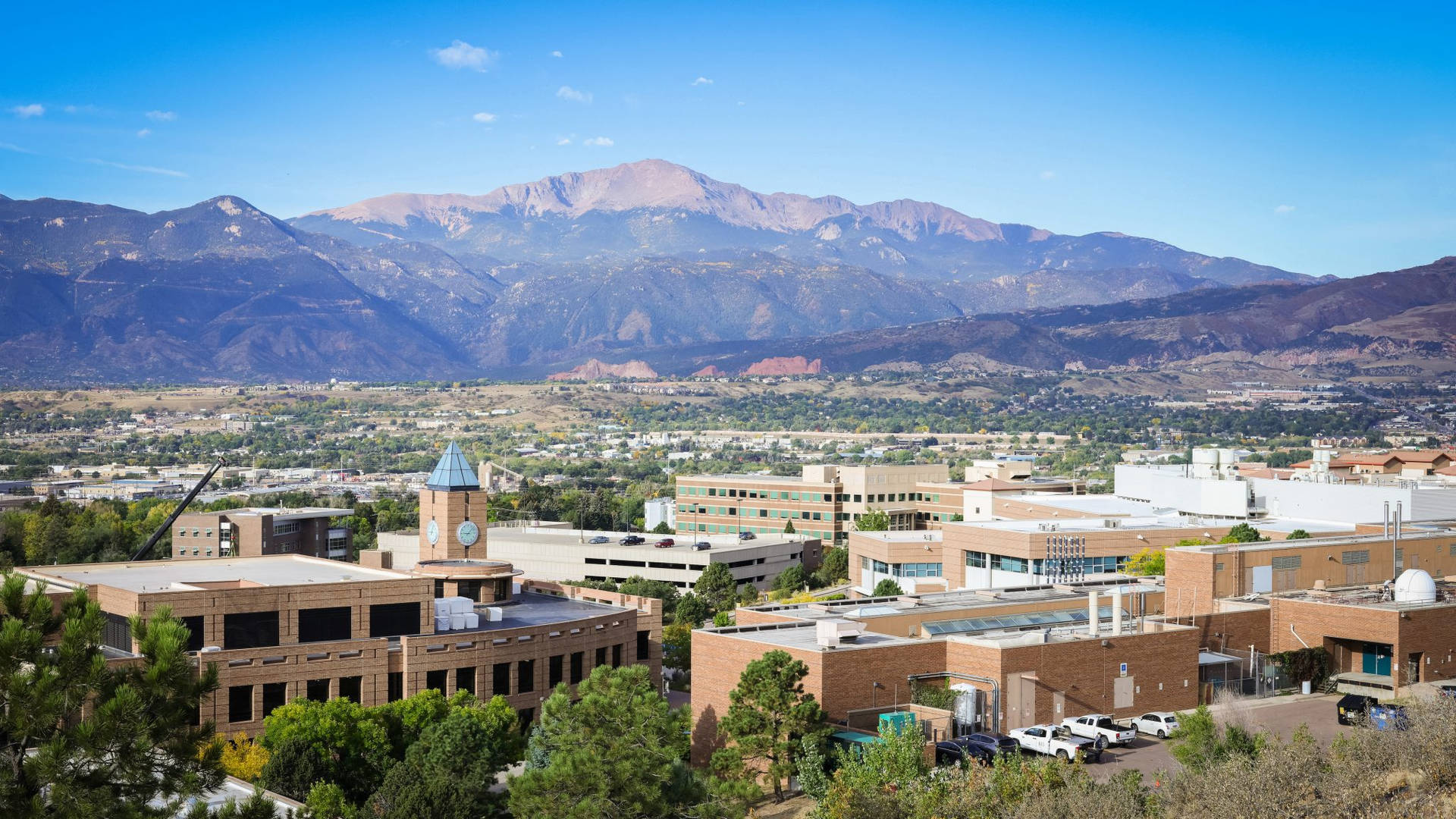 Majestic View of the University of Colorado with Mountain Backdrop Wallpaper
