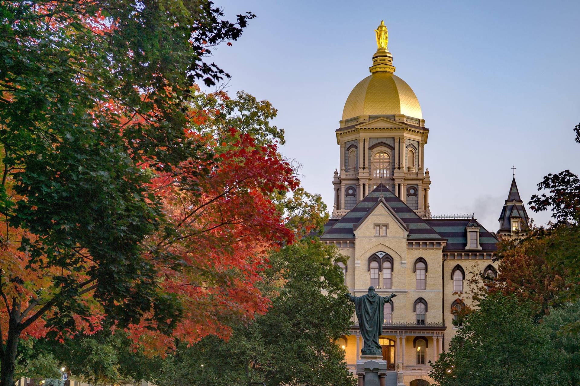 University Of Notre Dame Golden Dome With Trees Wallpaper