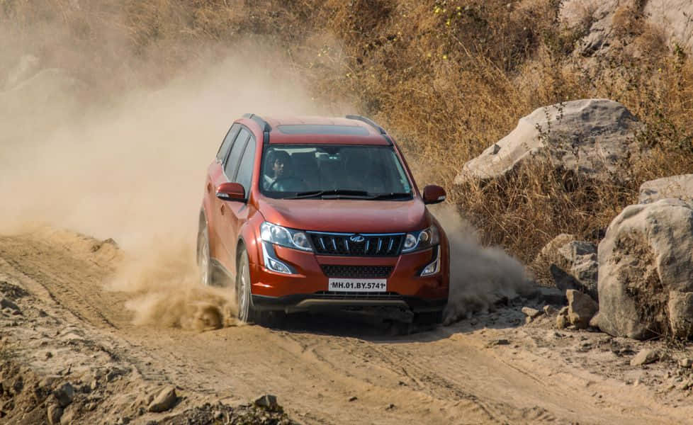 Unleash The Beast - Majestic Mahindra Xuv500 On The Move Wallpaper