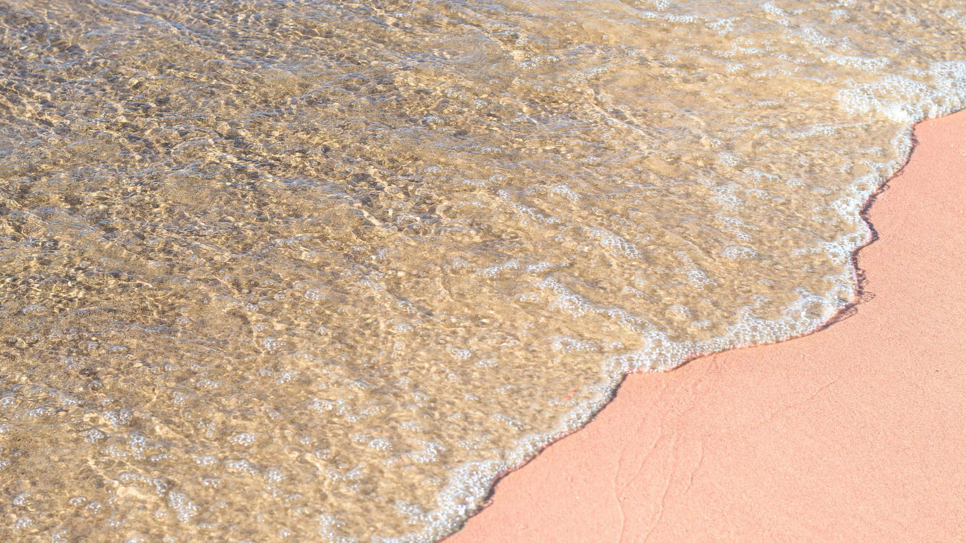 Unparaíso Escondido: Impresionante Vista De La Impresionante Playa Rosada Fondo de pantalla
