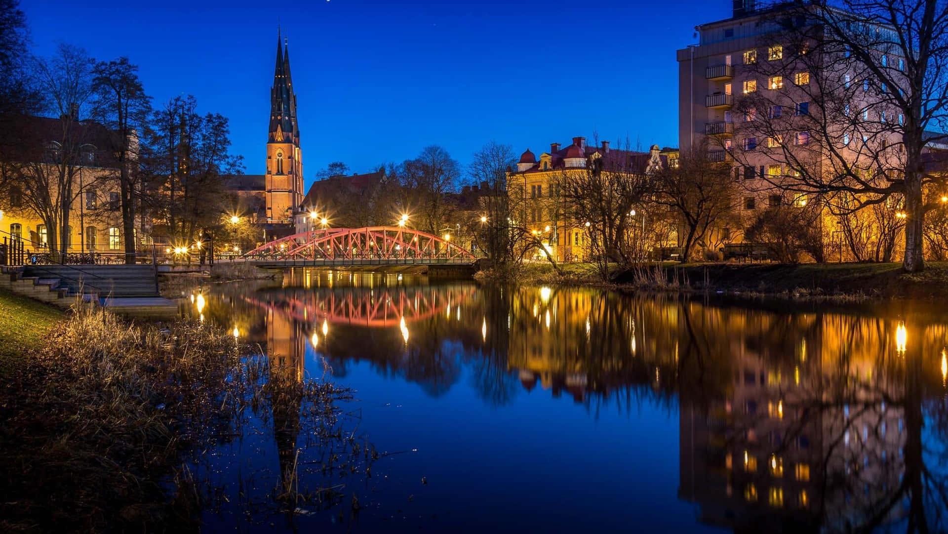 Uppsala Nighttime River Reflections Wallpaper