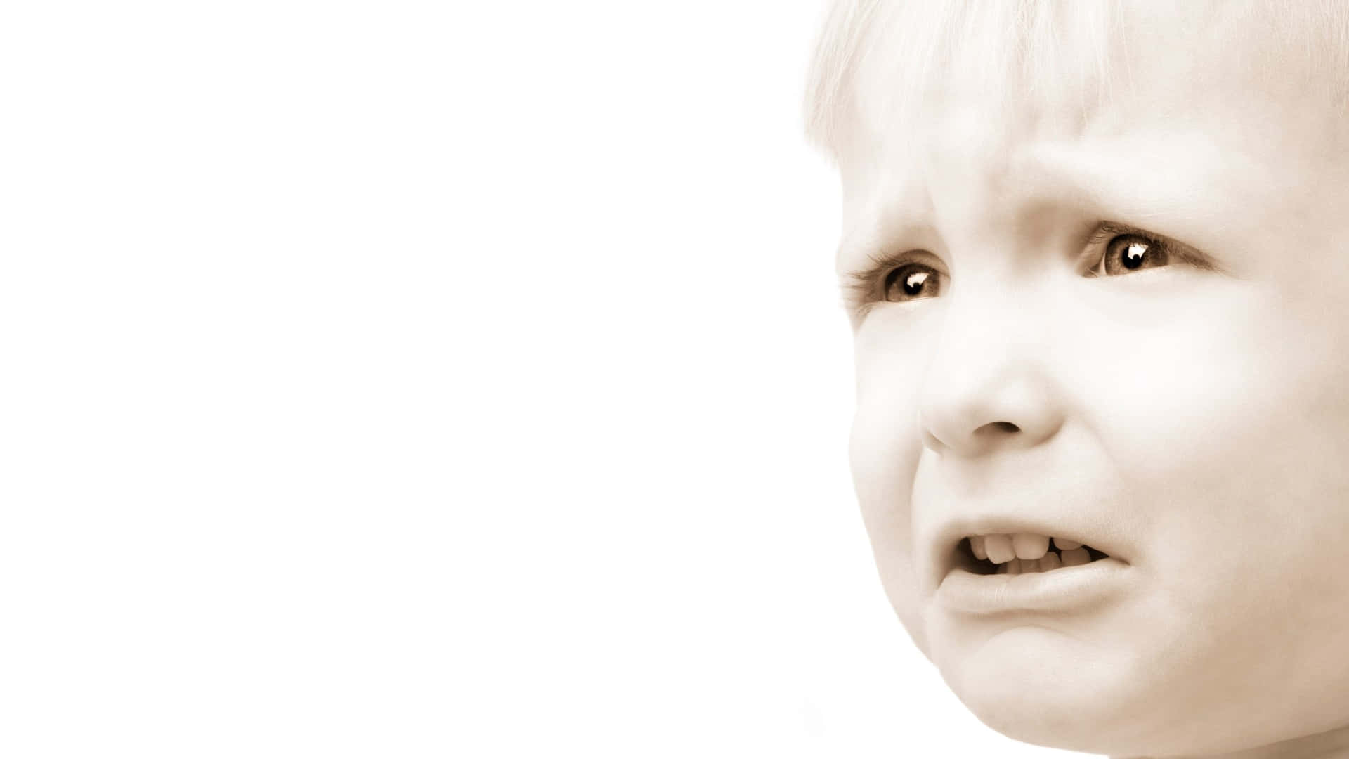 Upset Child Whining Expression Wallpaper