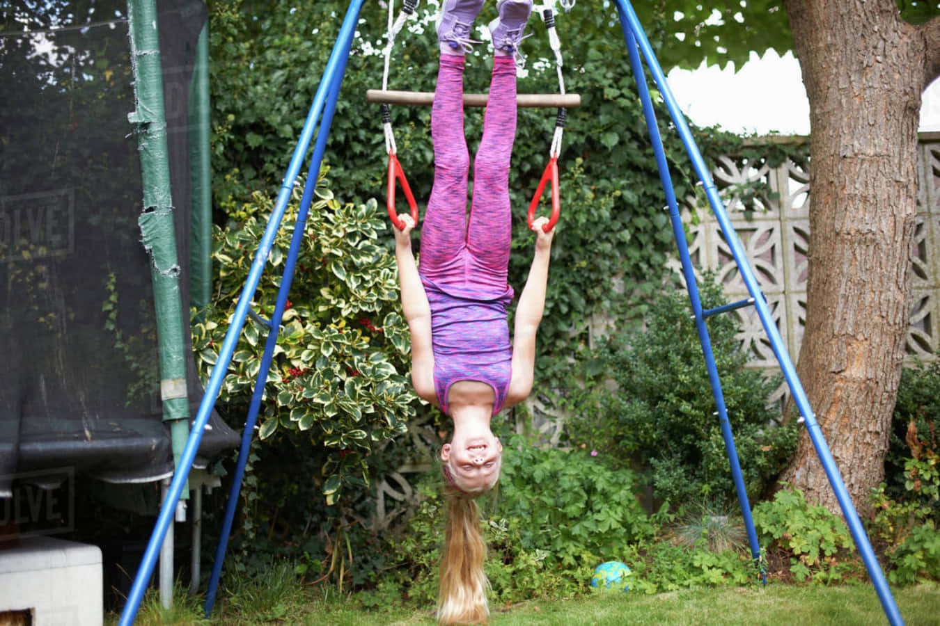 A Girl Is Hanging Upside Down