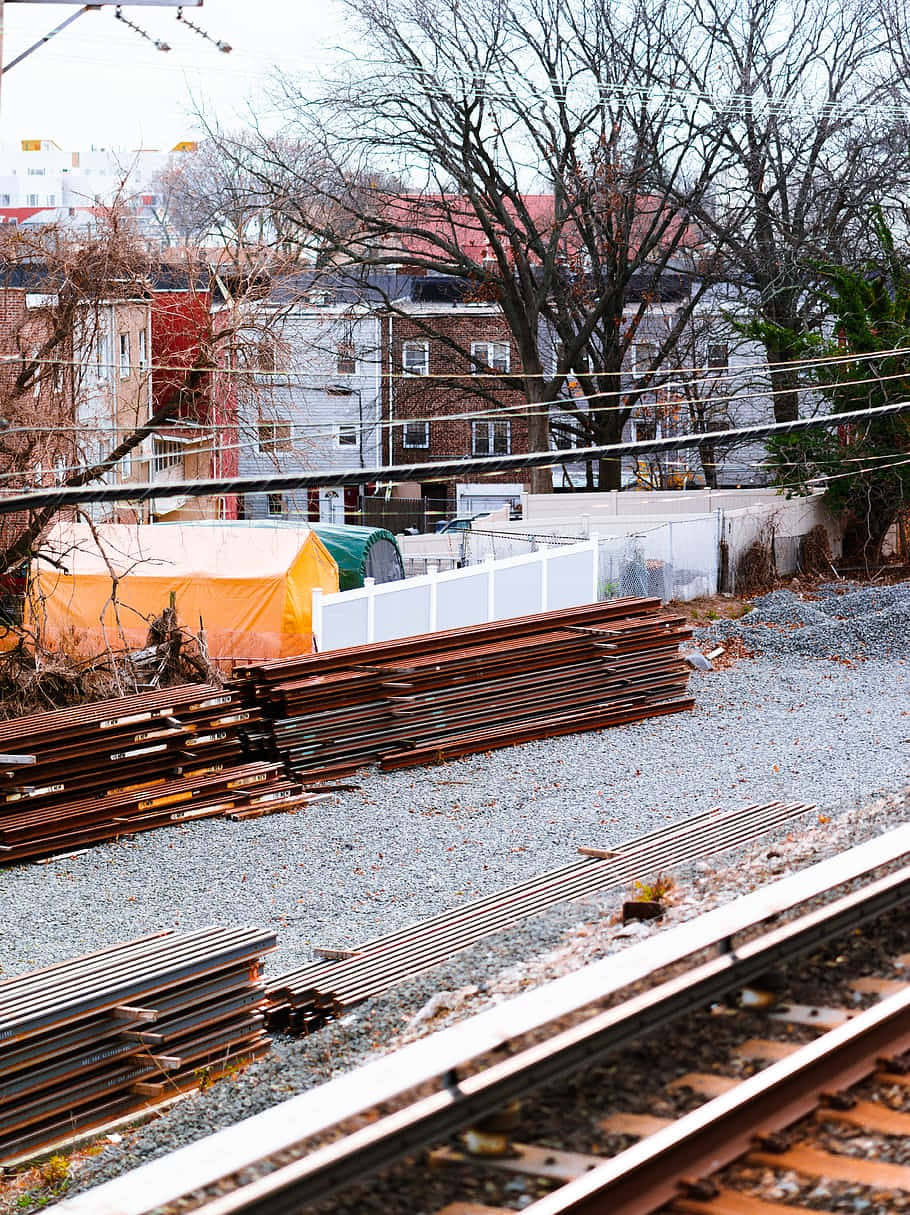 Urban Construction Site Near Railroad Wallpaper