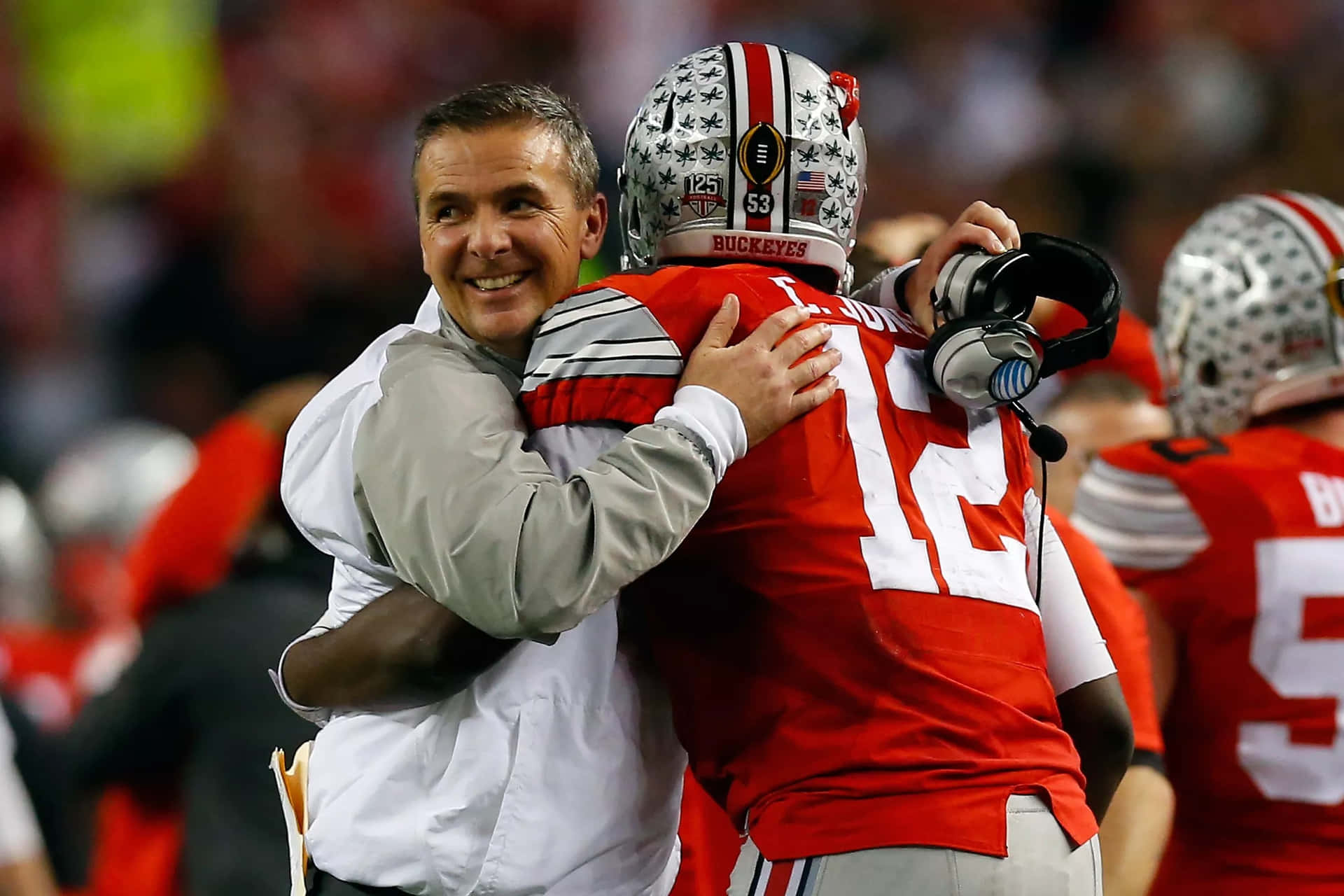 Ohio State Football Coach John Mcgillis Hugs His Teammate