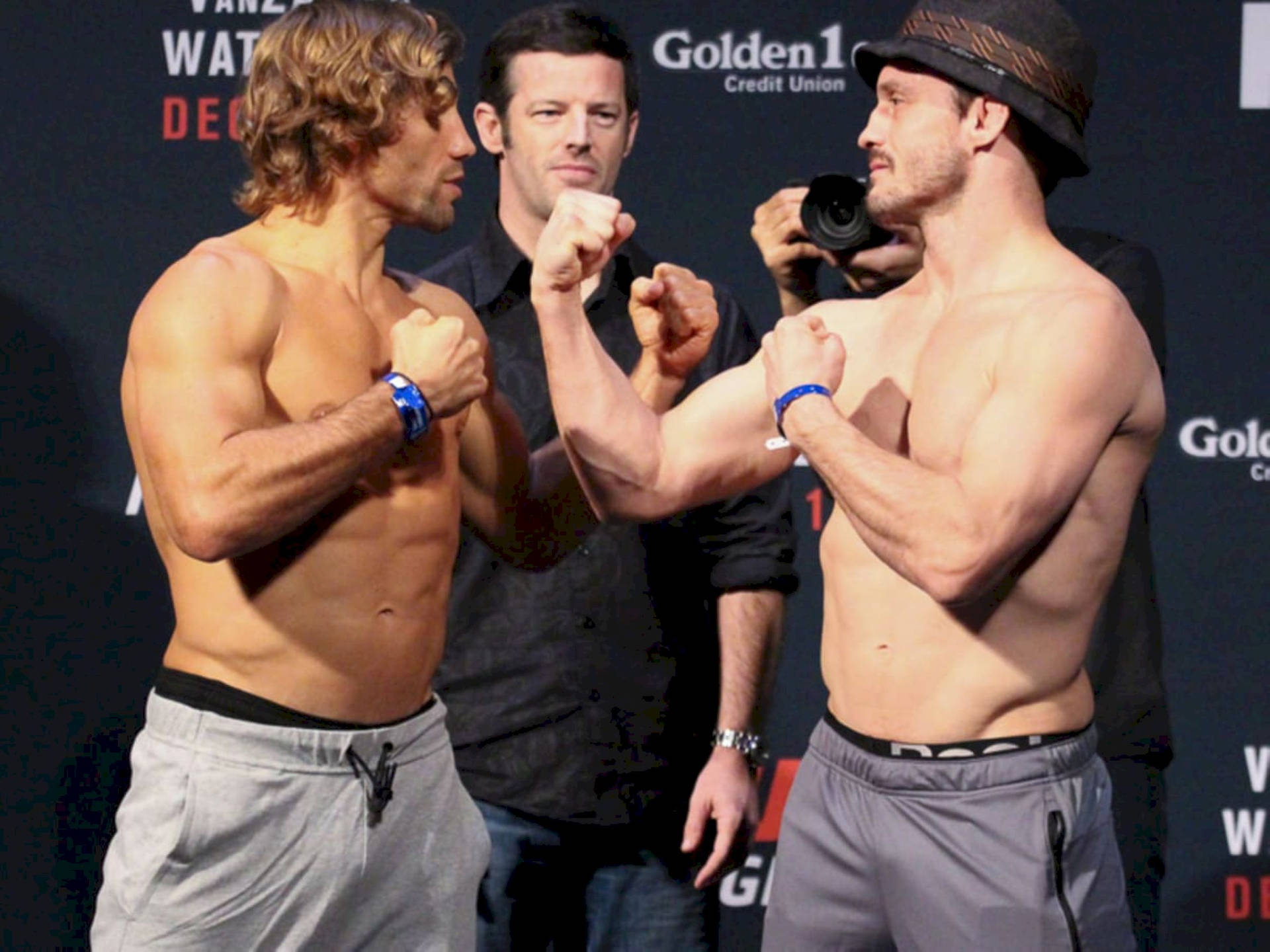 Urijah Faber Face Off With Opponent Wallpaper