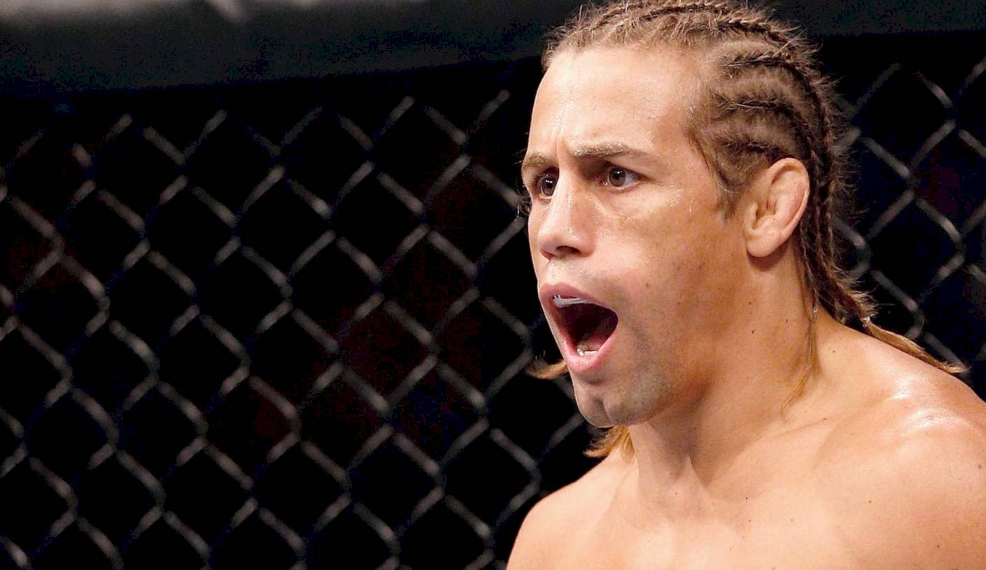 Urijah Faber Yelling In The Ring Wallpaper