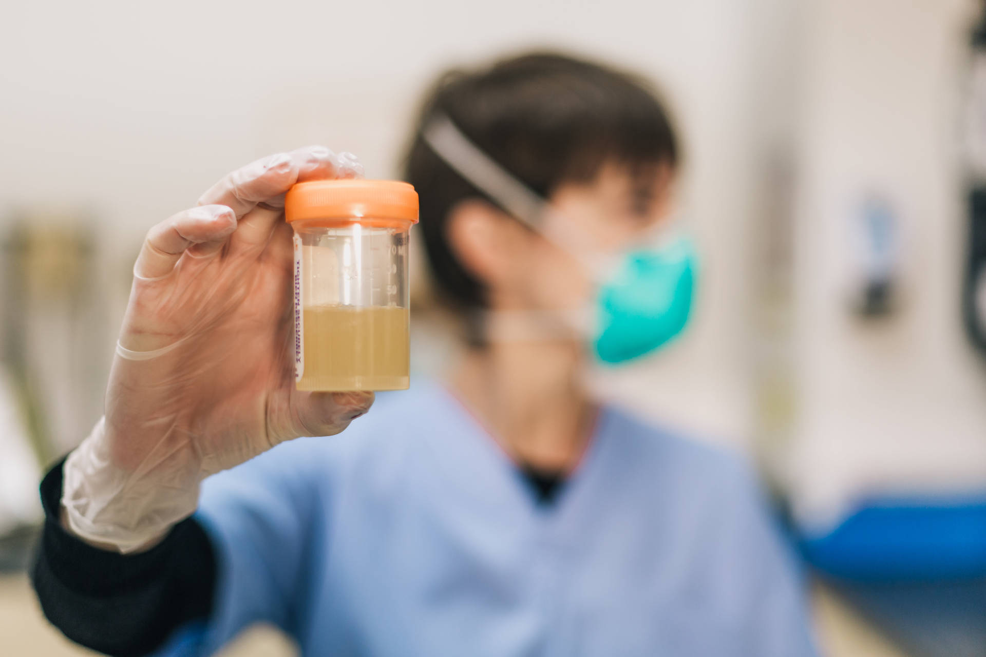 Urine Laboratory Test Sample In Cup Wallpaper
