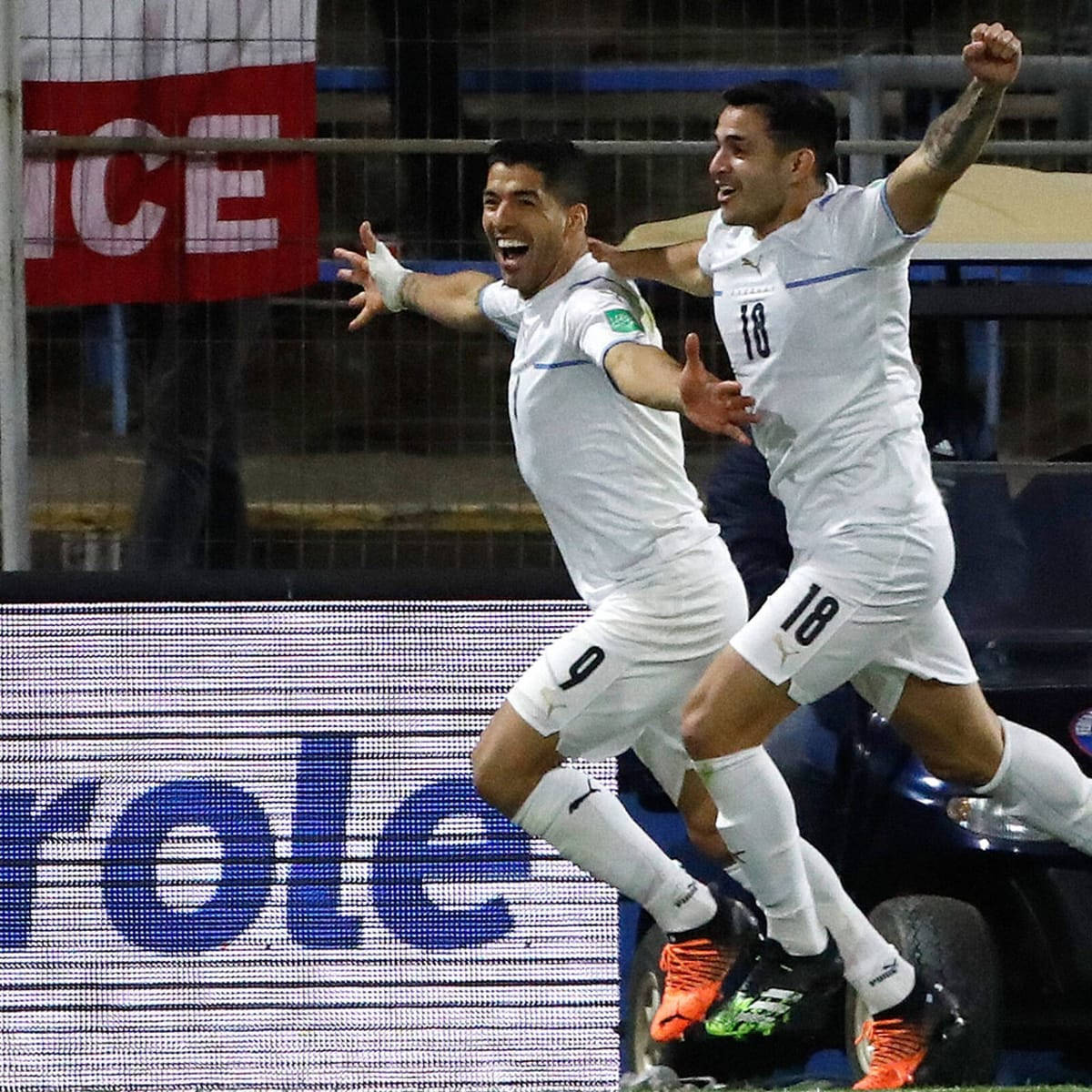 Celebratory Moment with Luis Suarez and Gomez in Uruguay National Football Team Wallpaper