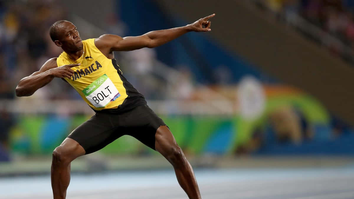 Usain Bolt Glowing with Victory in Signature Pose Wallpaper