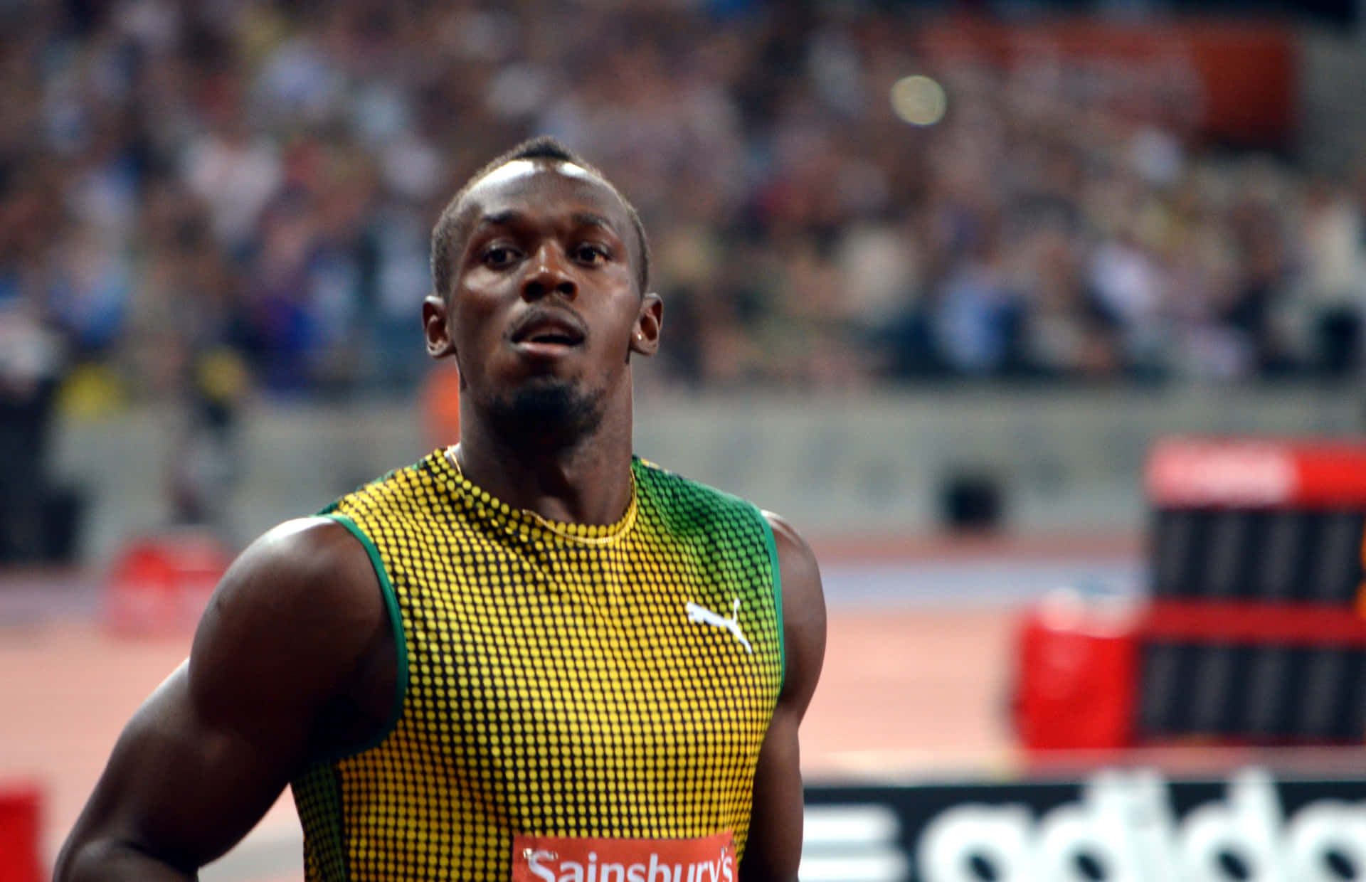 Usain Bolt ser på kameraet. Wallpaper