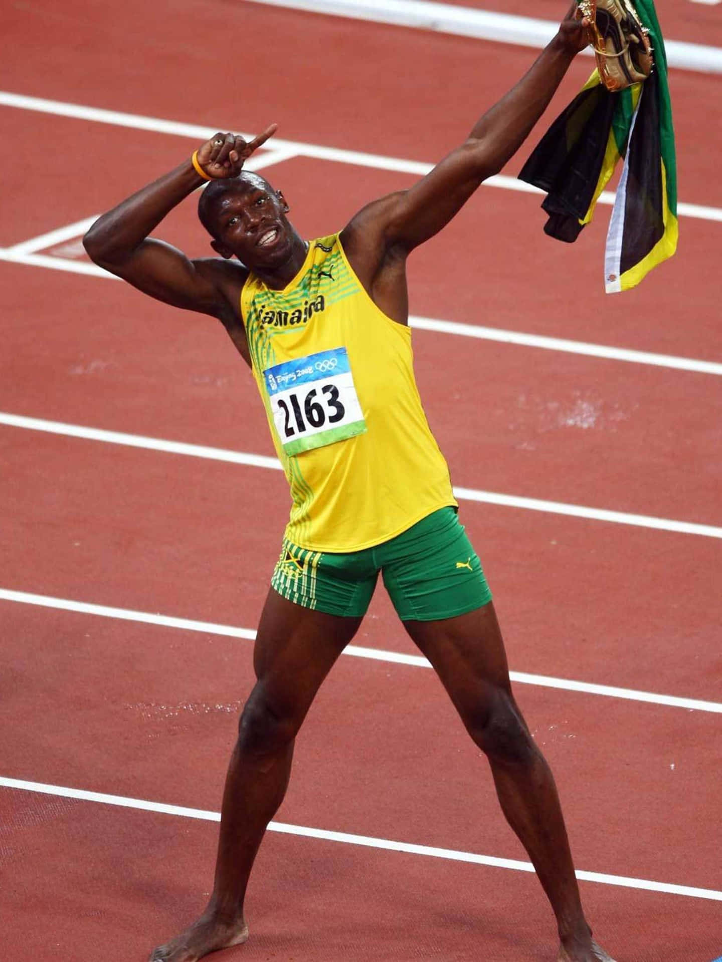 Usain Bolt stiller sig op på banens tapet. Wallpaper