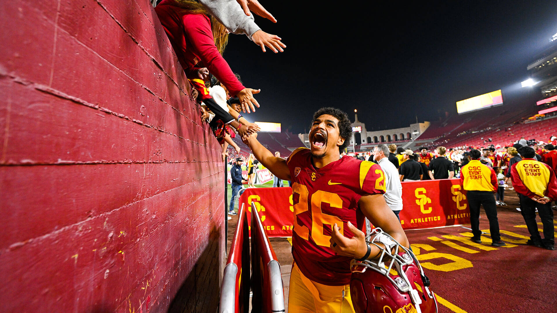 Usc Football Player And Fans