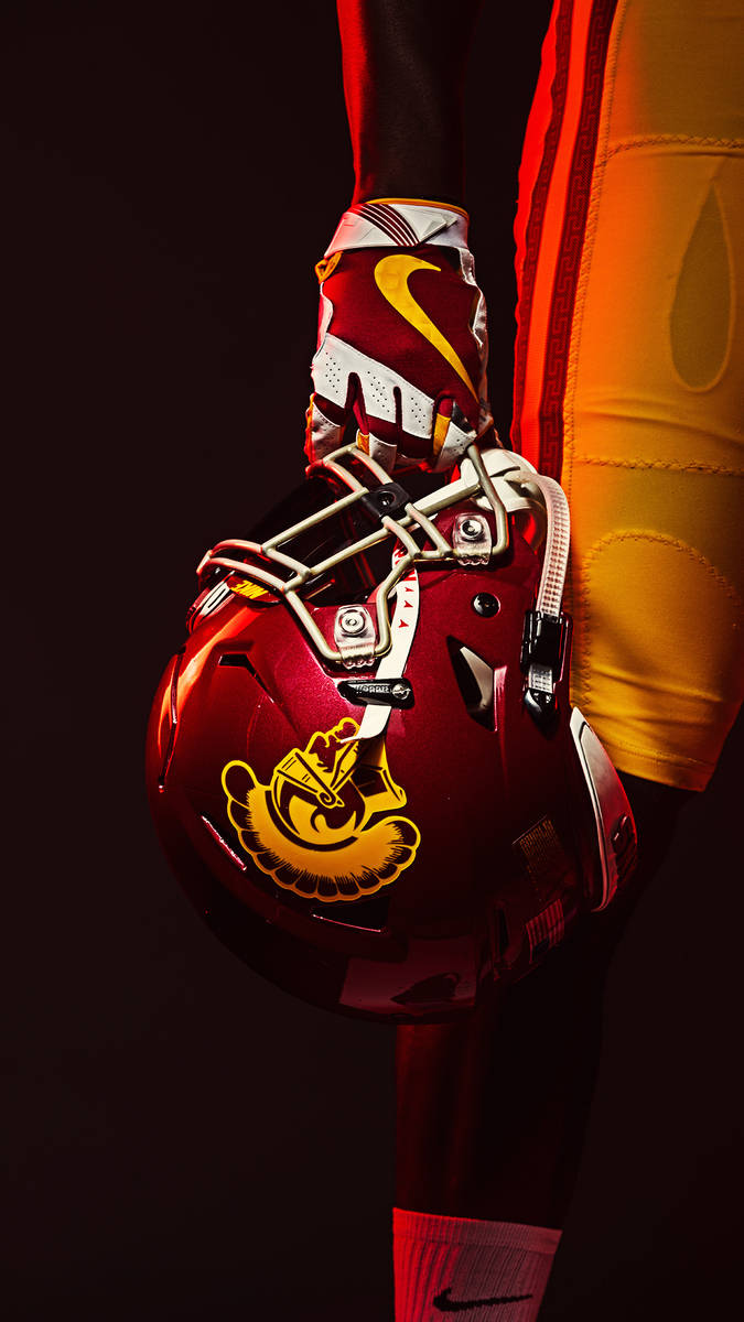 USC Football Player Holding Helmet Wallpaper