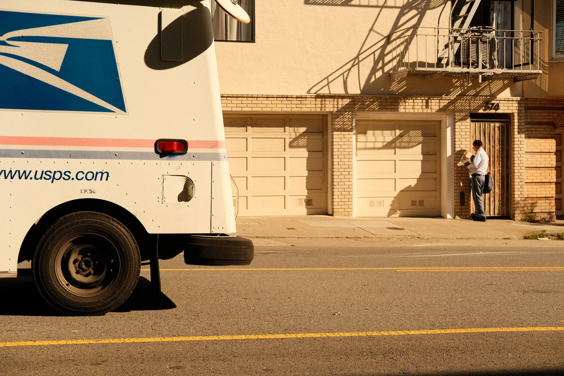 USPS Tracking Truck Parked During Daytime Wallpaper