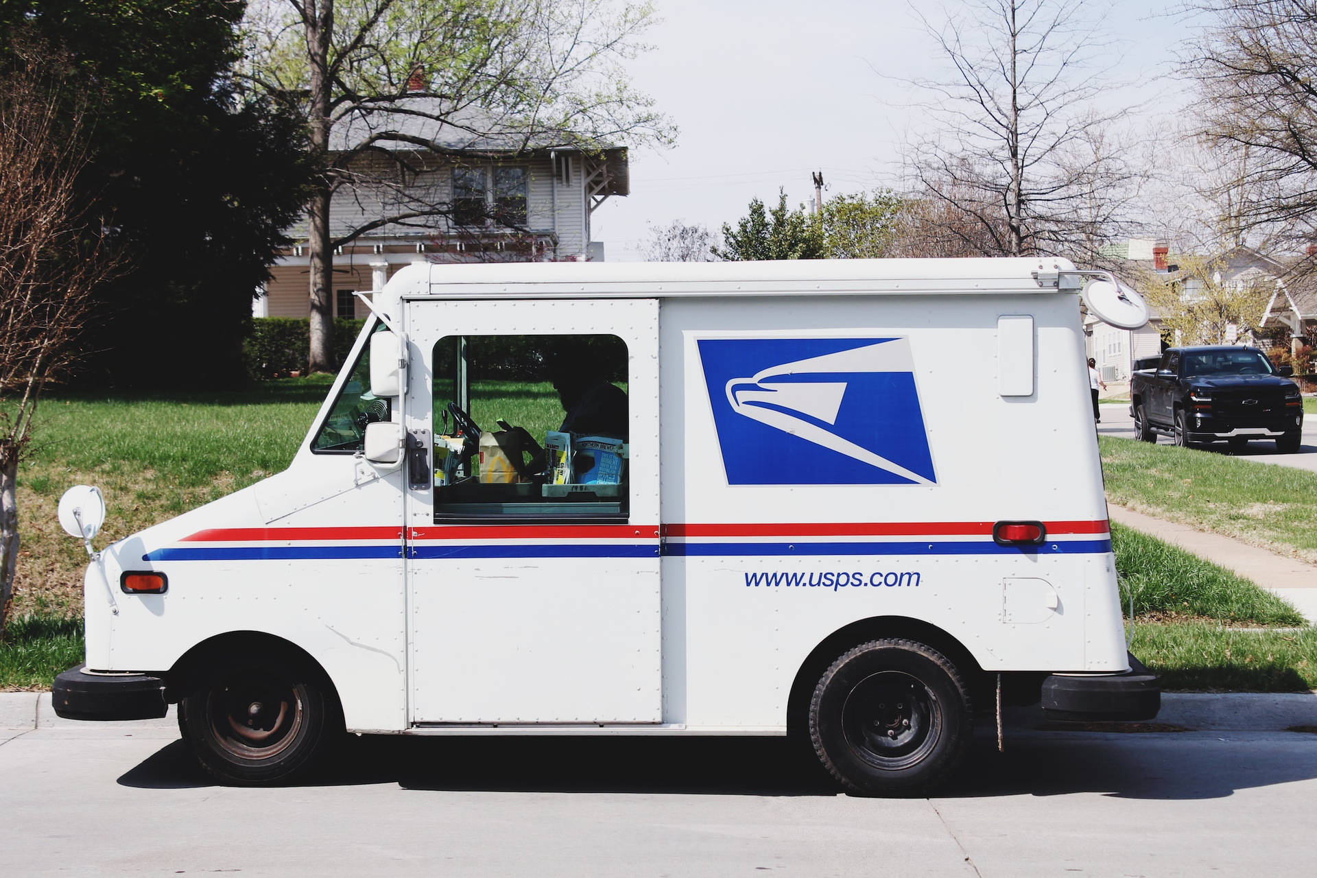 Usps Tracking Truck Parked Pavement Wallpaper