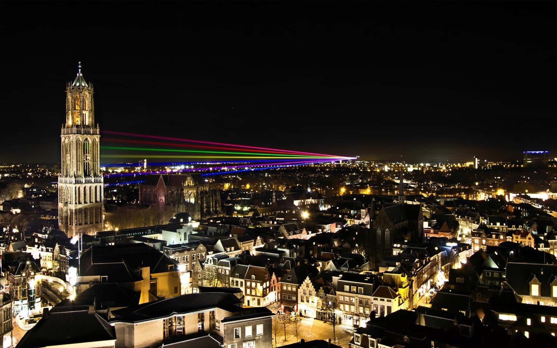 Utrecht Night Skylinewith Dom Towerand Laser Show Wallpaper