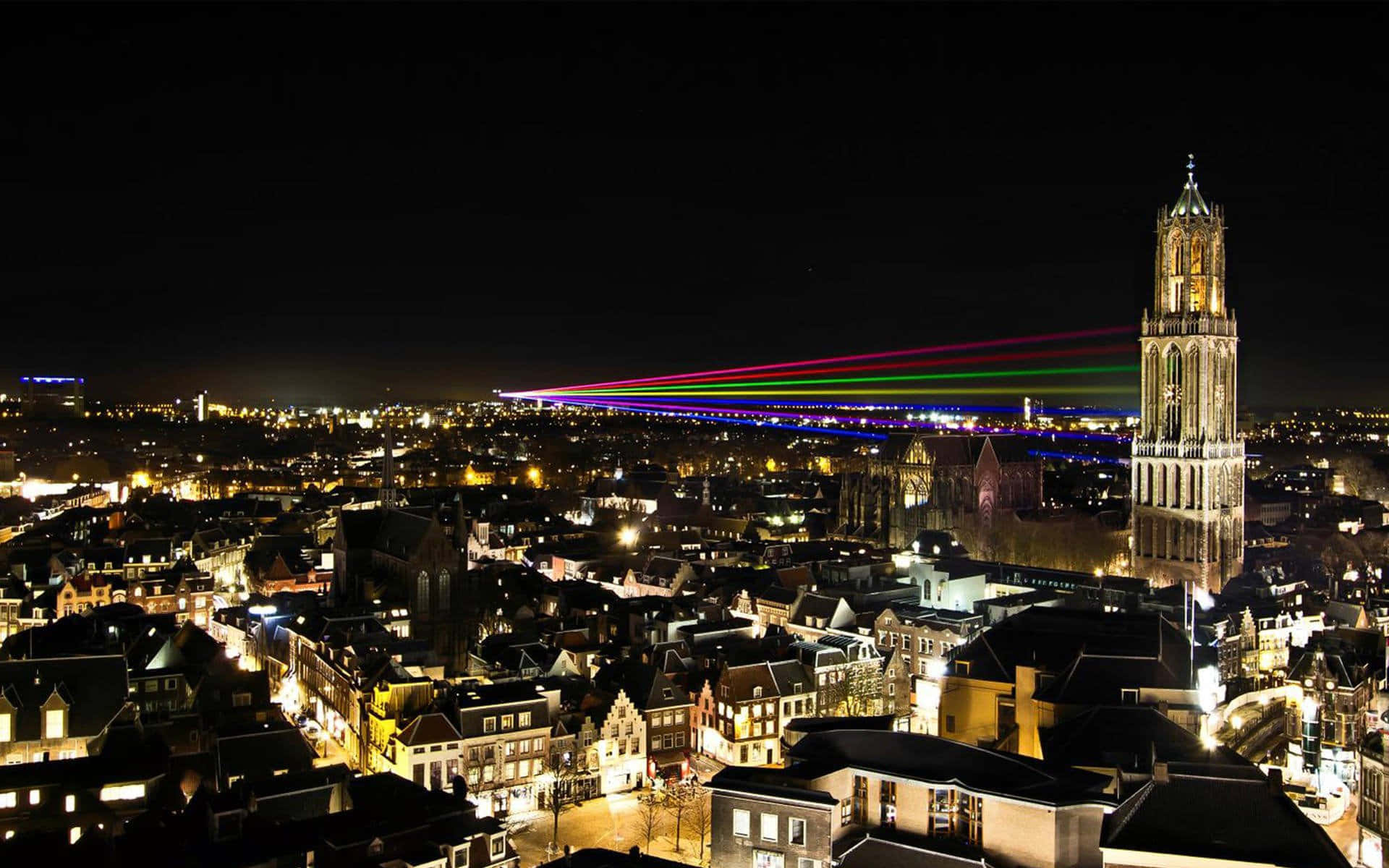 Utrecht Night Skylinewith Dom Towerand Laser Show Wallpaper