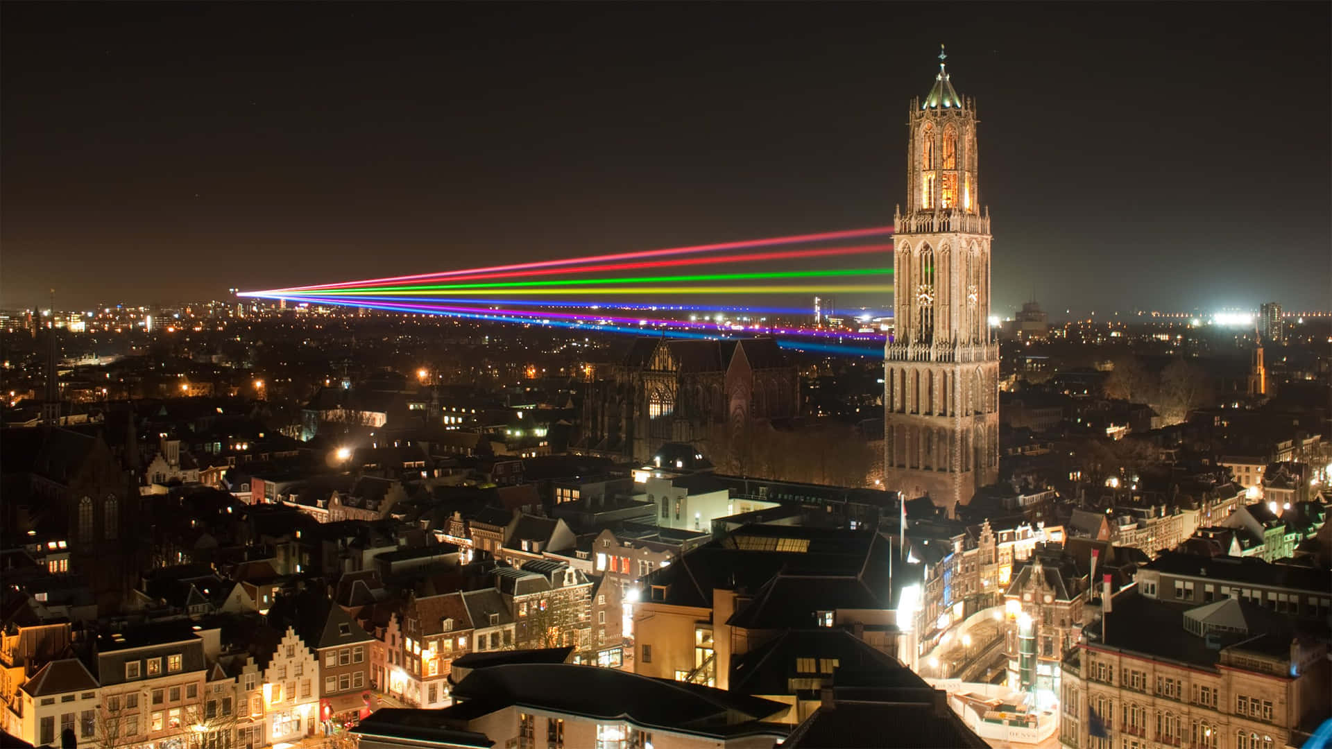 Utrecht Night Skylinewith Rainbow Laser Installation Wallpaper