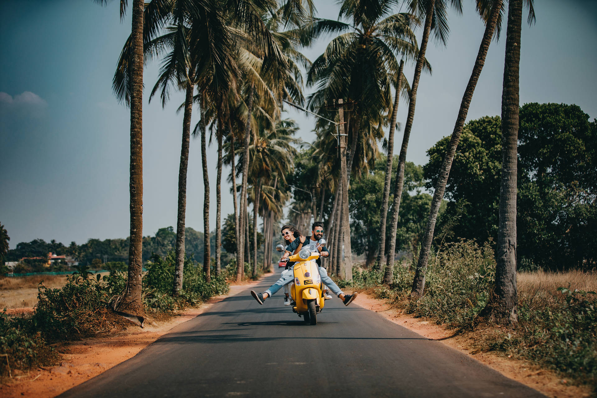 Vacation Couple On Scooter Wallpaper
