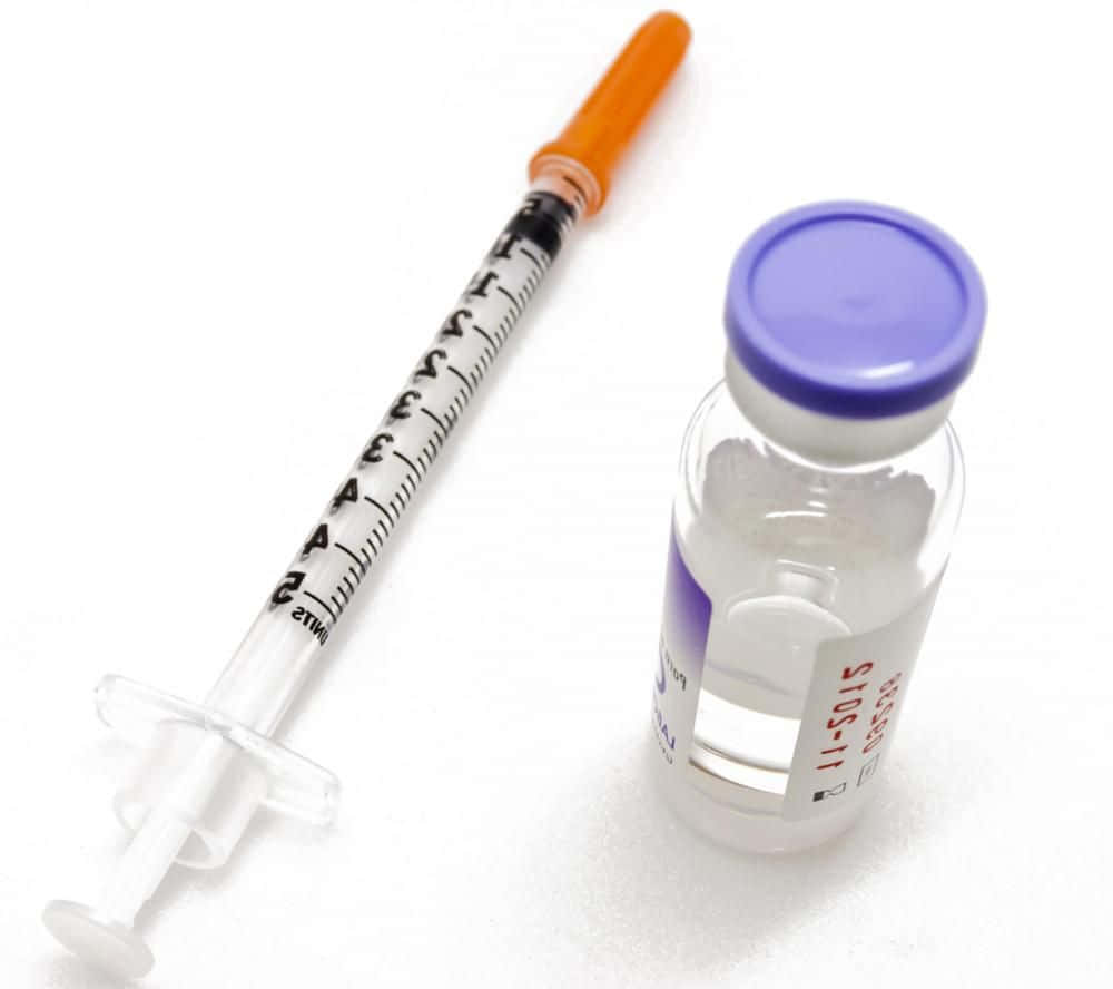 Impfstoffflascheund Injektionsbild