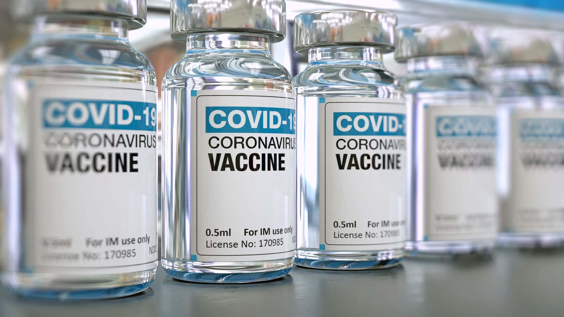 Close-up shot of vaccine and syringe against a bright background.