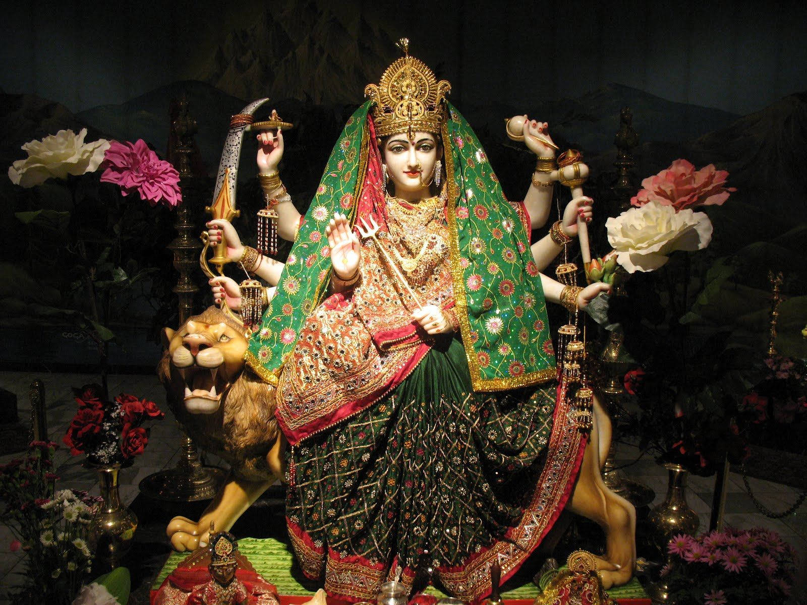 Vaishno Devi Statue Sidder På En Brølende Løve Wallpaper