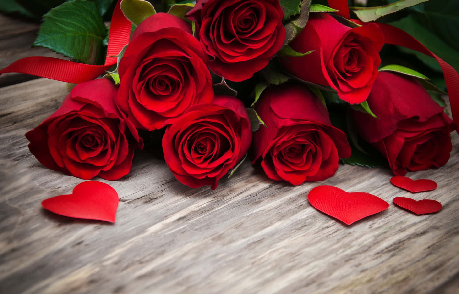 Red Roses With Hearts On A Wooden Table Wallpaper