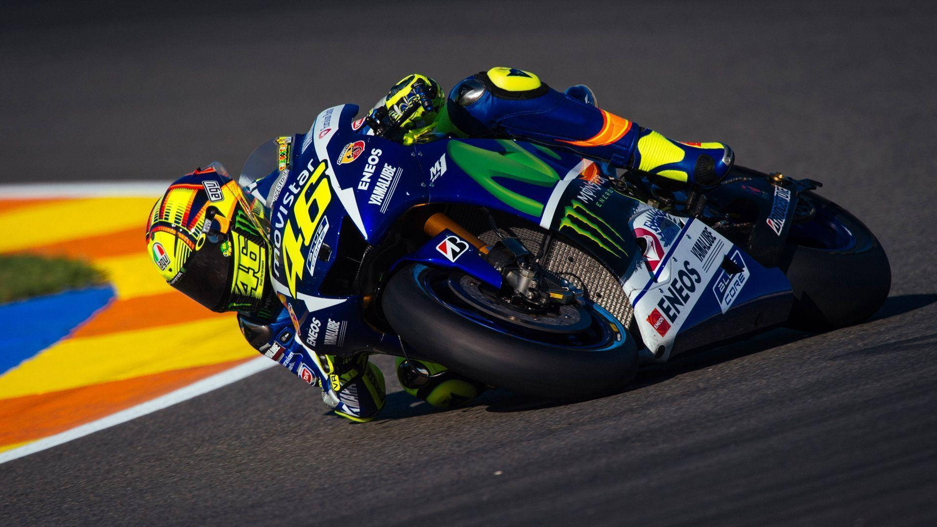 Valentino Rossi mastering a stunning banking curve Wallpaper