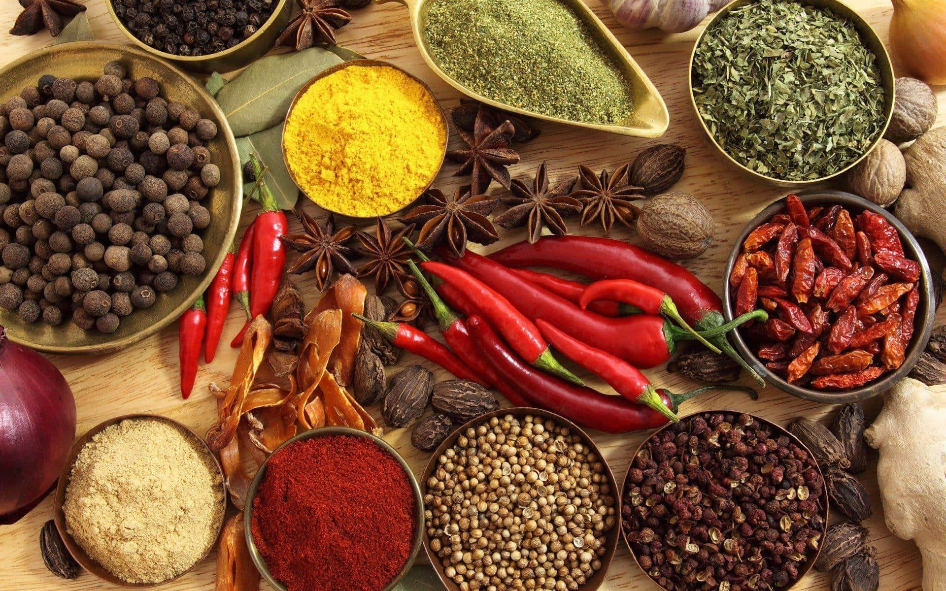 Variety Of Spices On Wooden Table Wallpaper