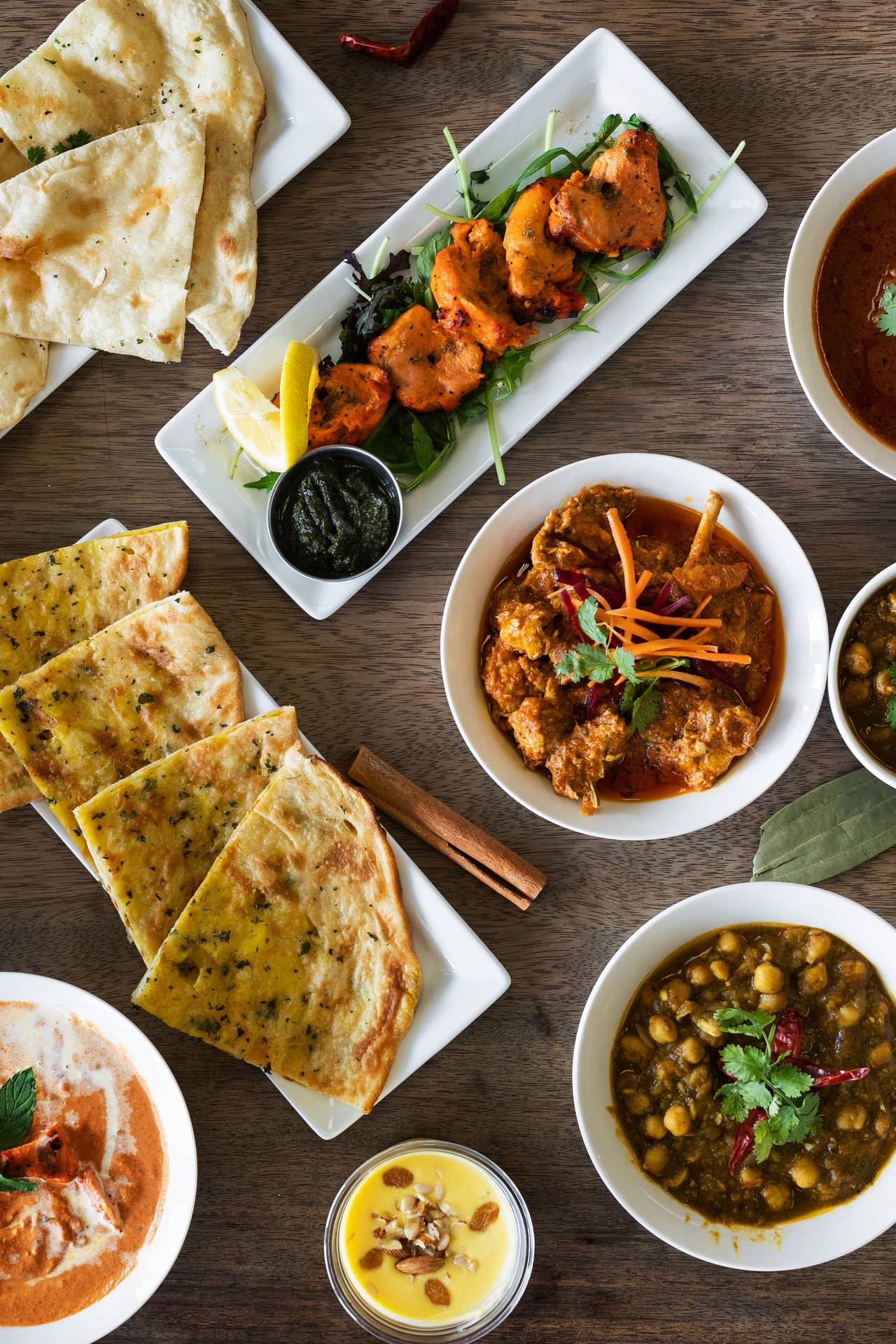 Verschillende indiske køkkenretter vist livfuldt Wallpaper