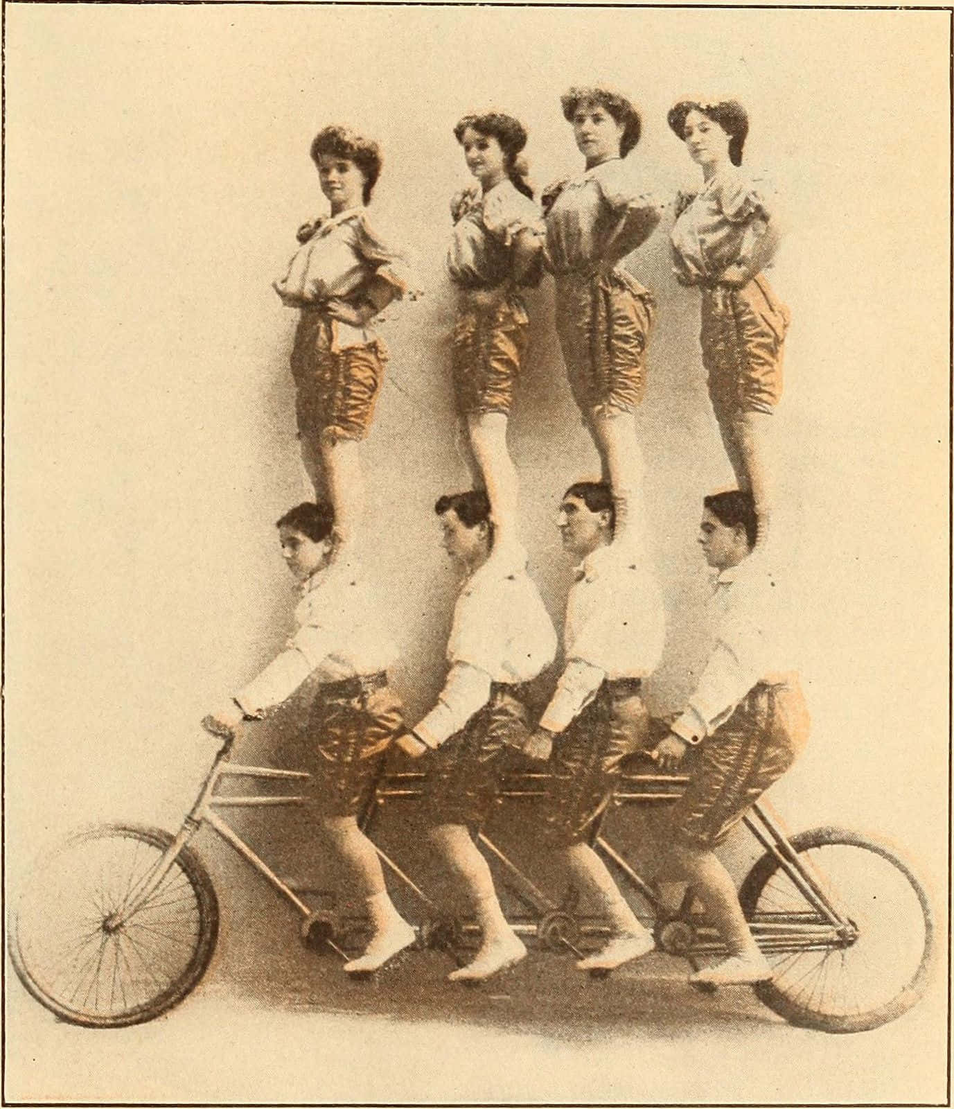 Vaudeville_ Troupe_on_ Tandem_ Bicycle Wallpaper
