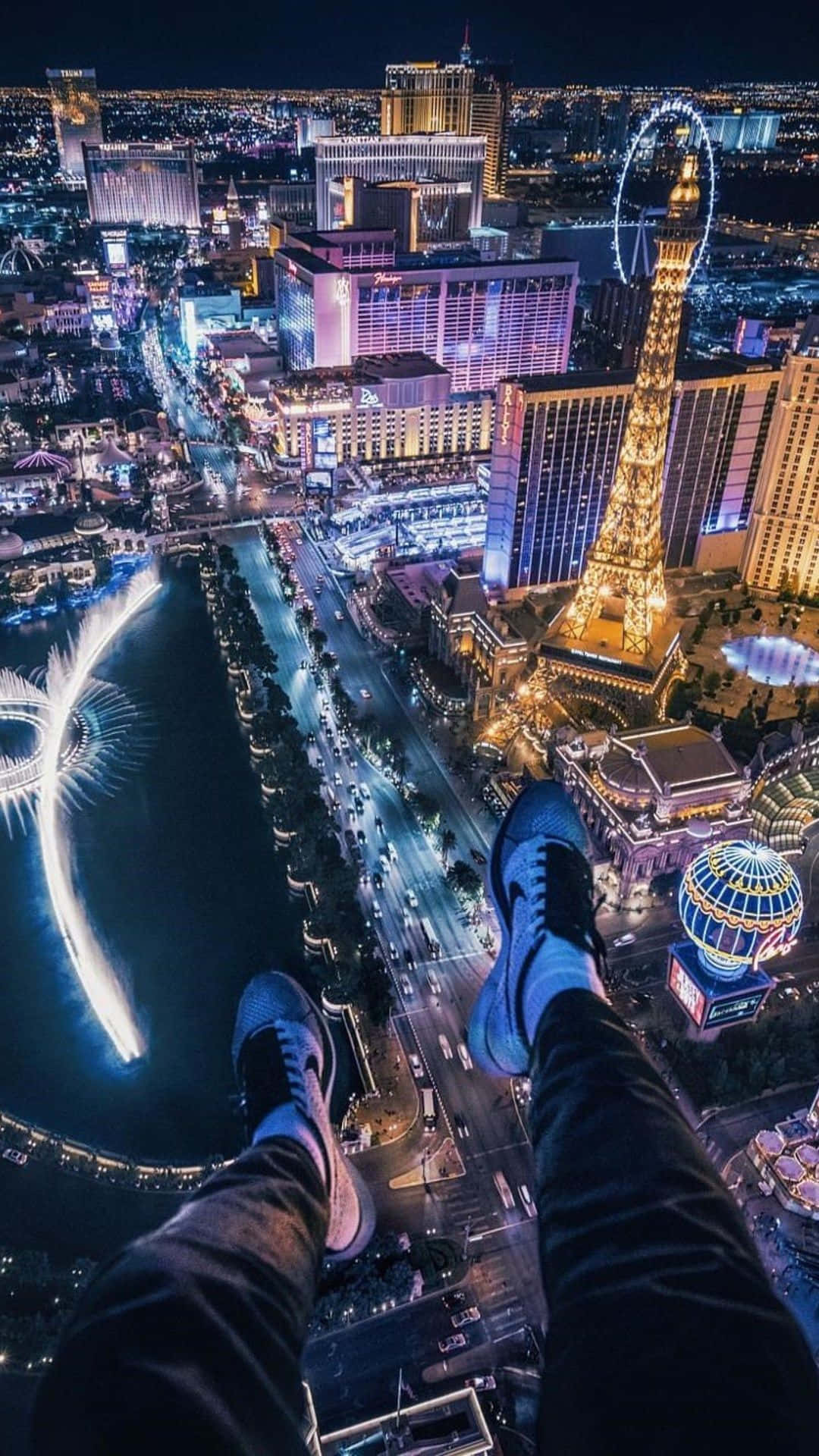 Hintergrundbilddes Bellagio Hotels Und Casinos Bei Nacht Mit Blick Auf Las Vegas (im Hochformat)