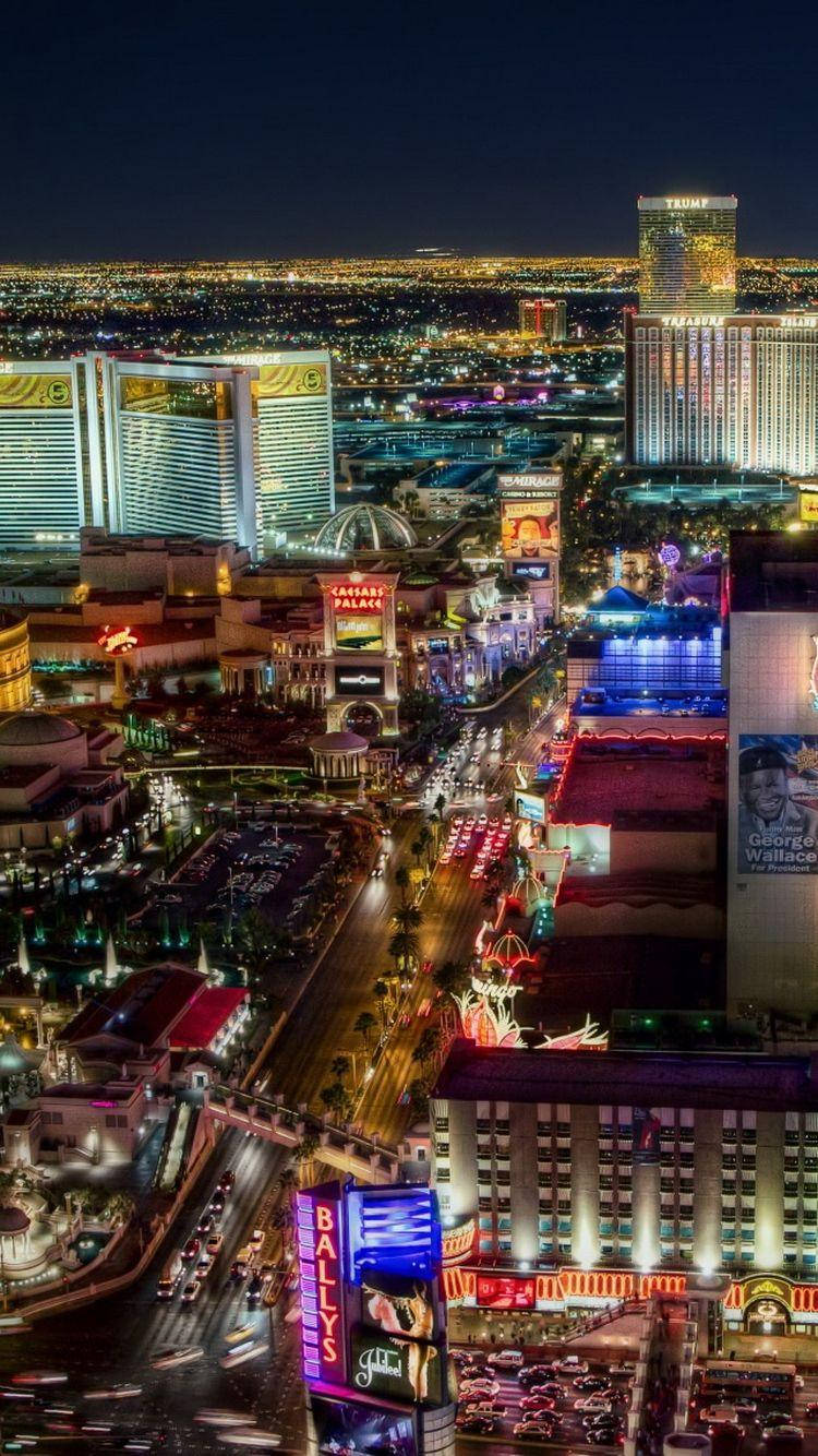 Ciudadde Vegas De Noche En Iphone. Fondo de pantalla