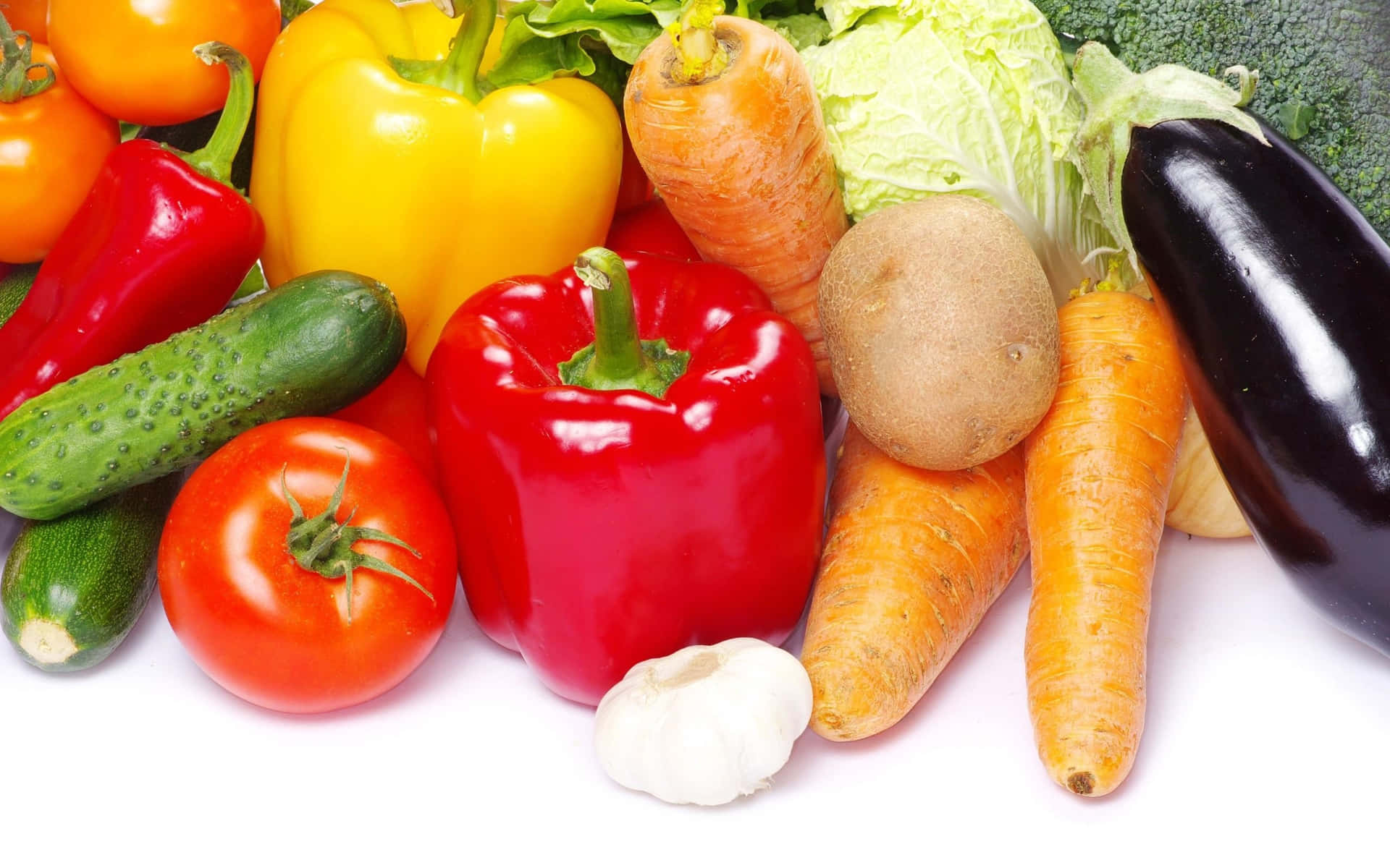 A Group Of Vegetables On A White Background