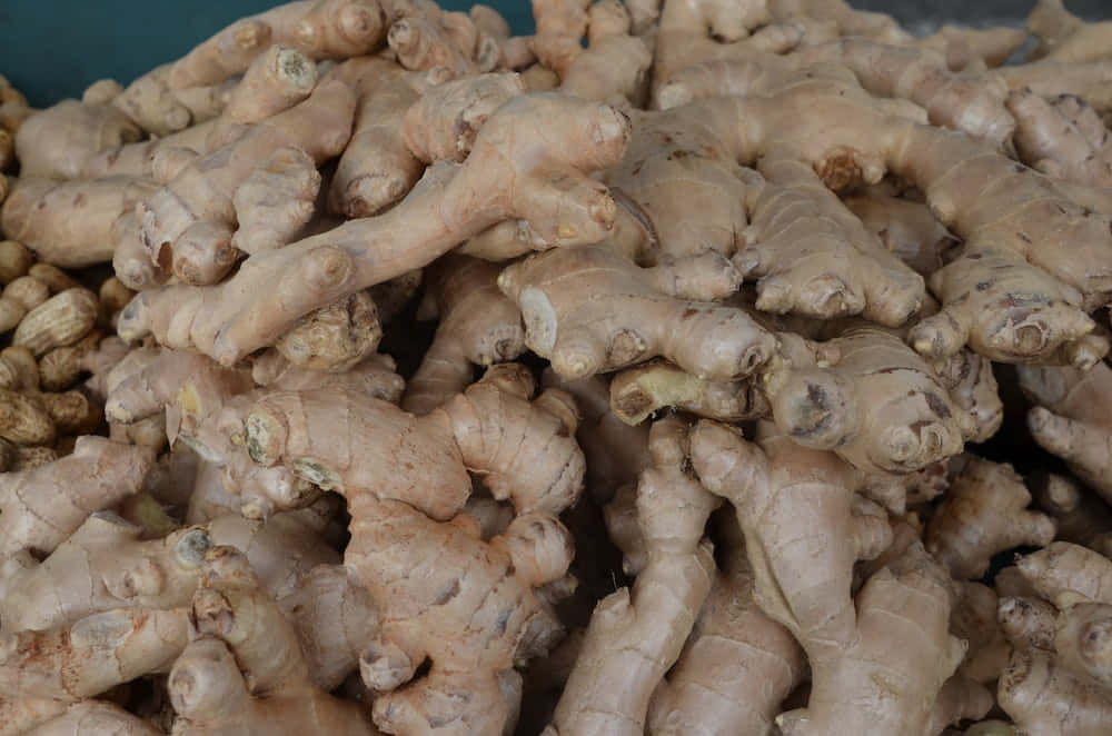 A Pile Of Ginger Is Piled Up In A Market