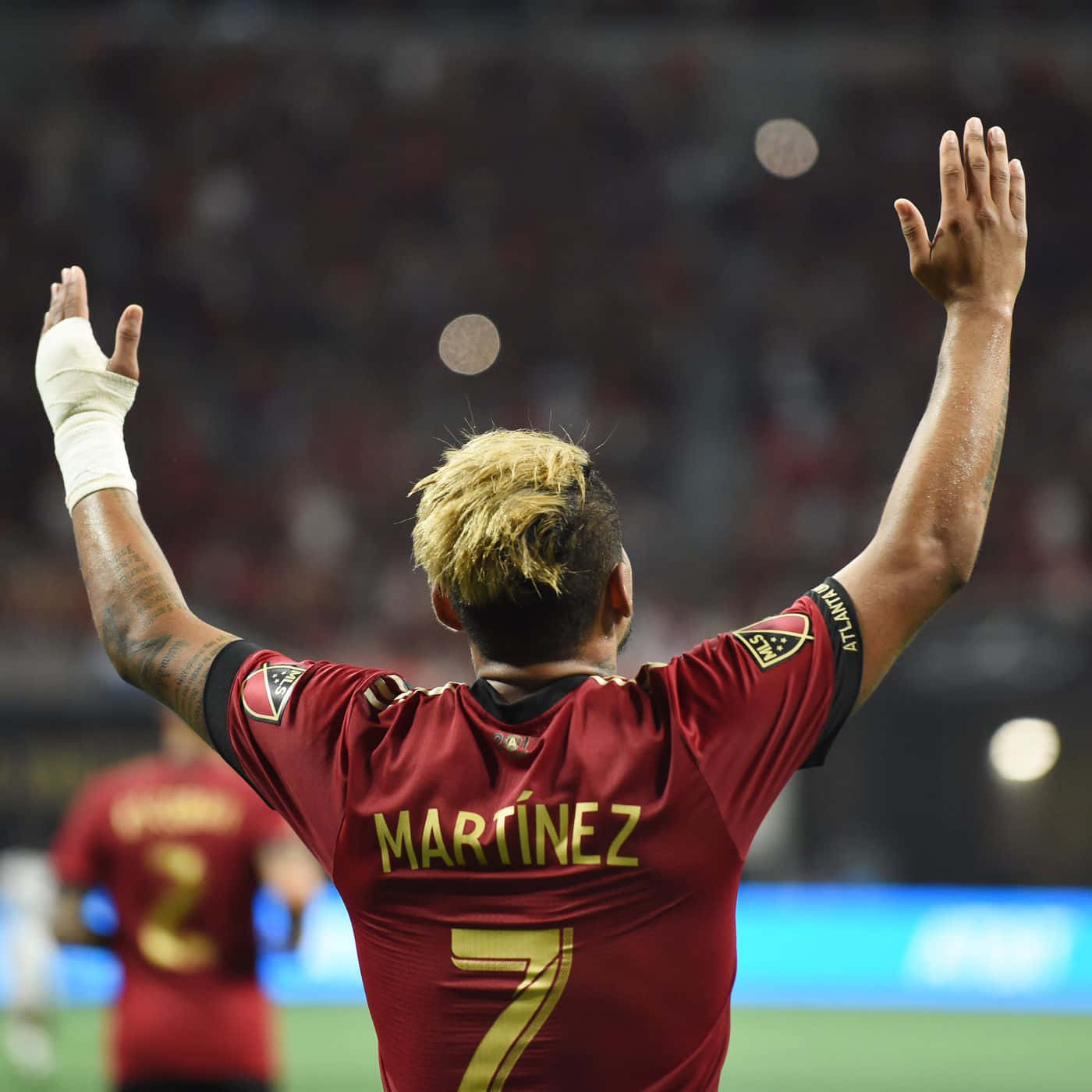 Venezuelan Footballer Josef Martinez Hands Raised Back Shot Wallpaper