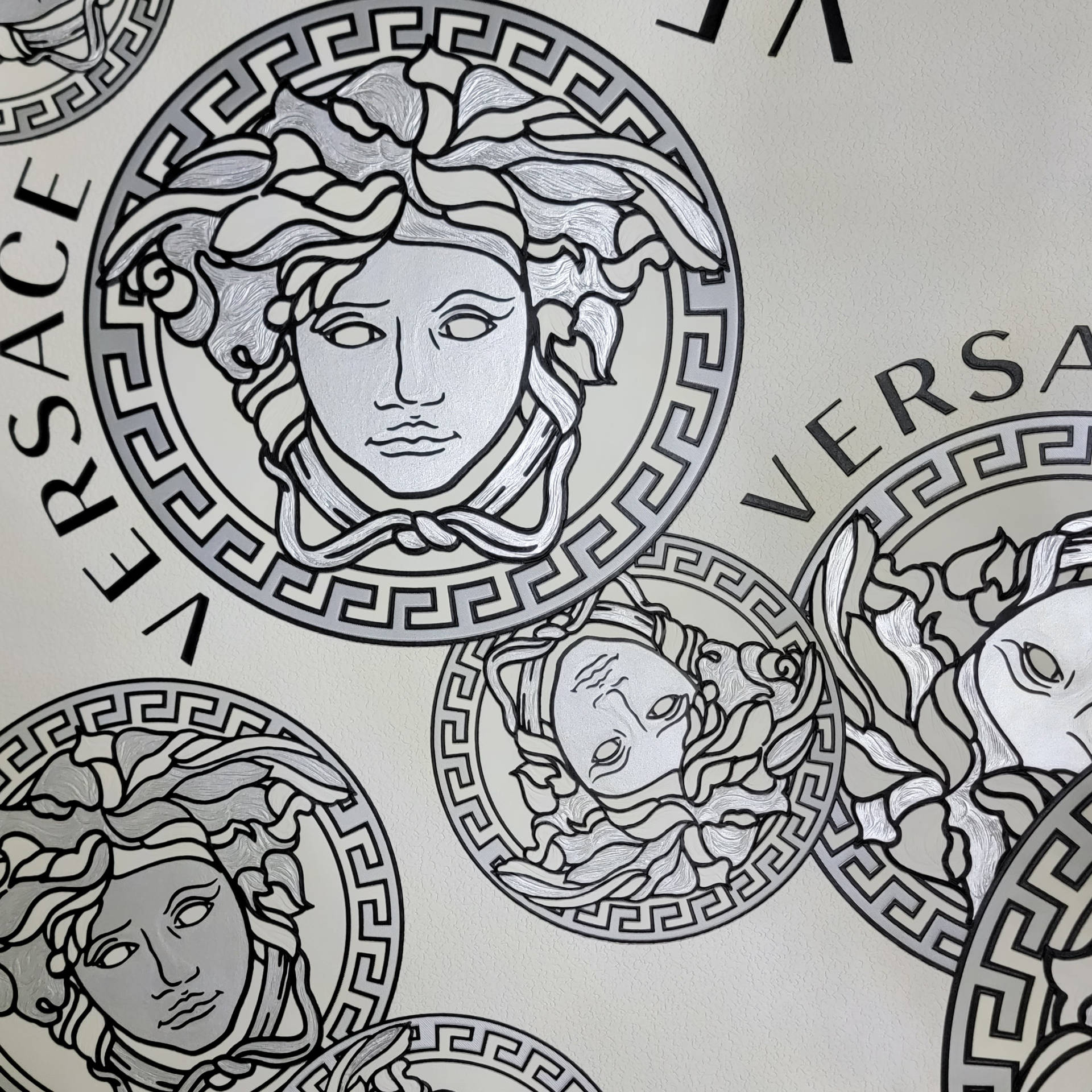 Versace Logo on a white background Wallpaper