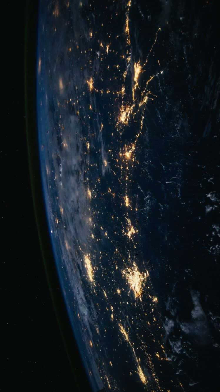 Et udsigt til jorden om natten fra rummet. Wallpaper