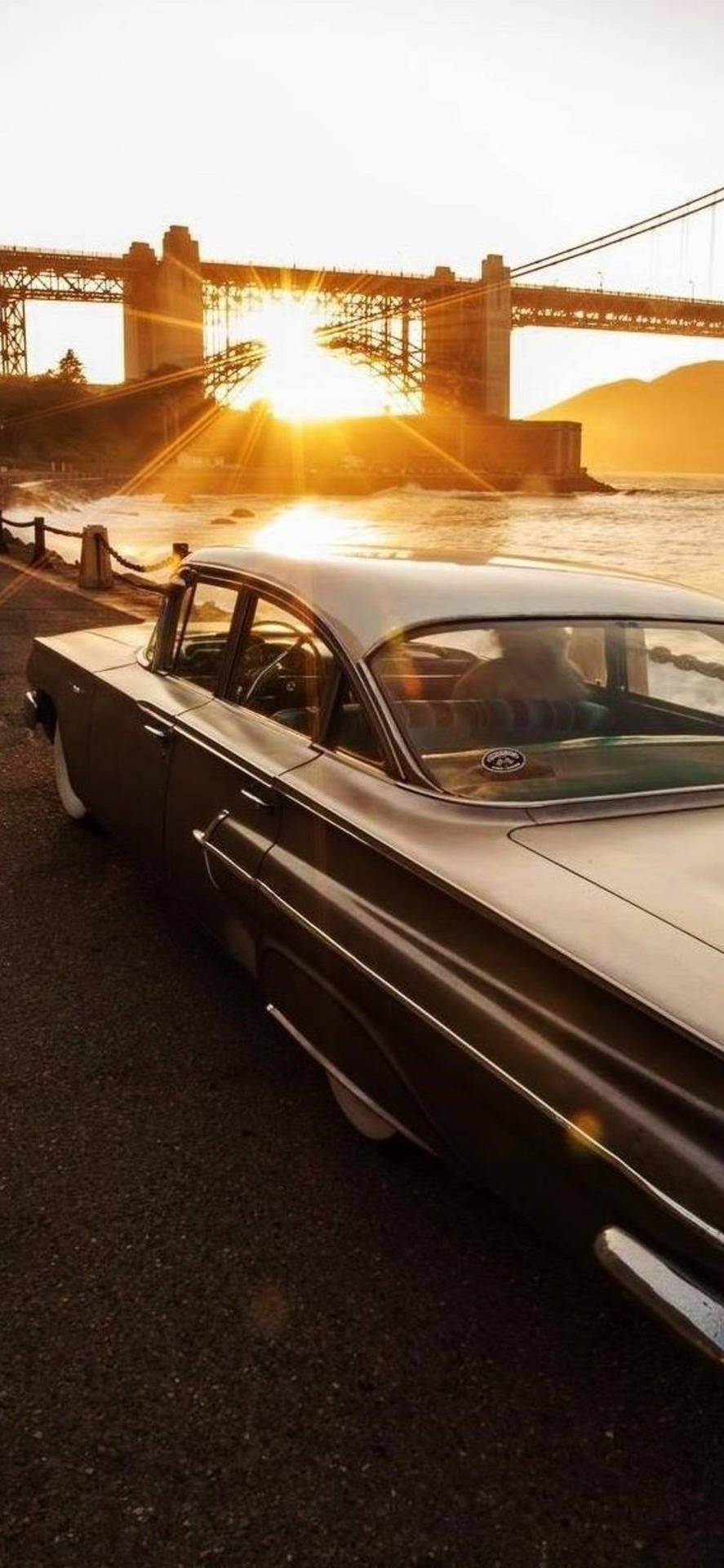 Vertical Vintage Cadillac Sunset Wallpaper