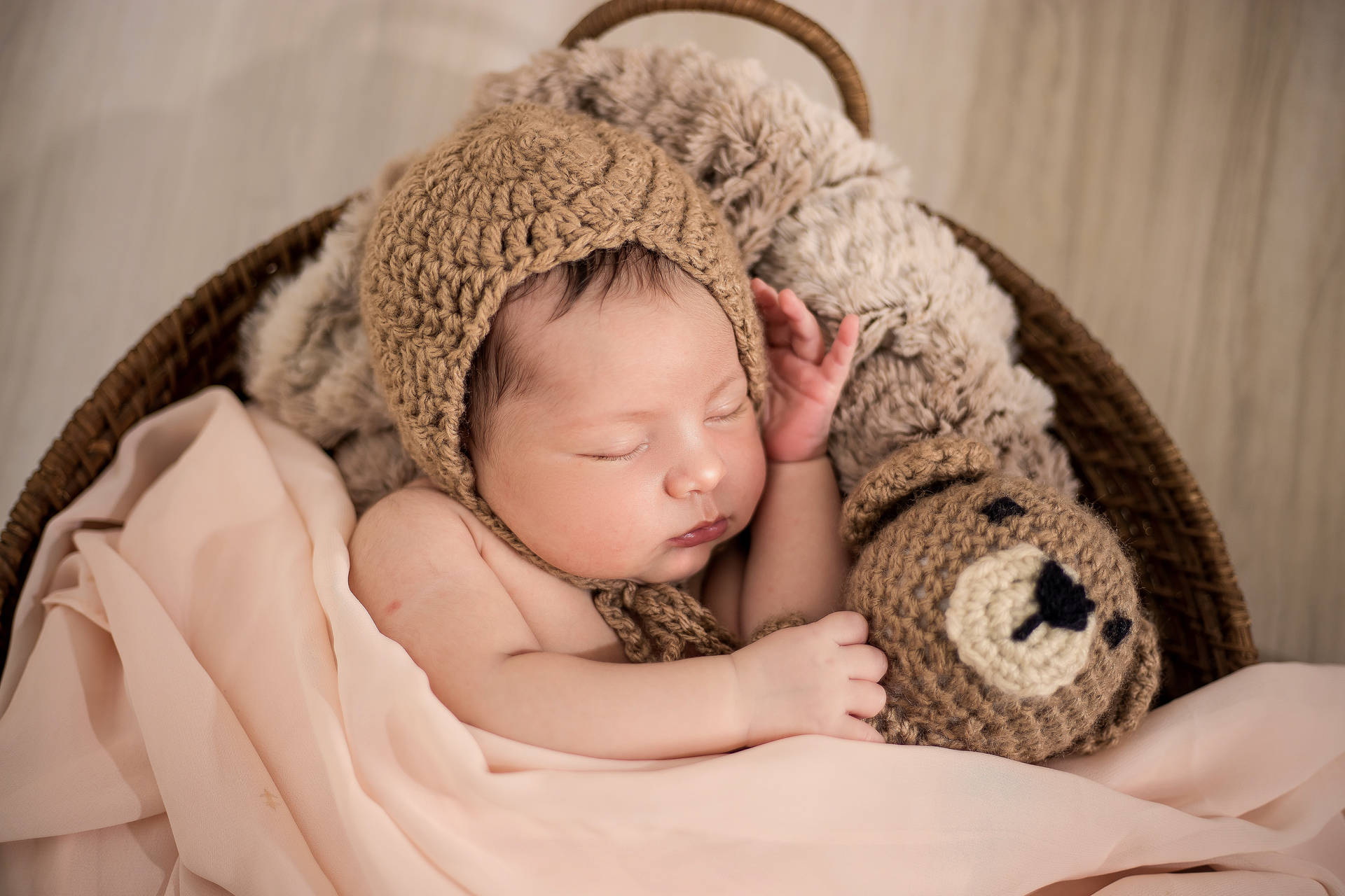 Very Cute Baby Wearing A Bonnet Wallpaper