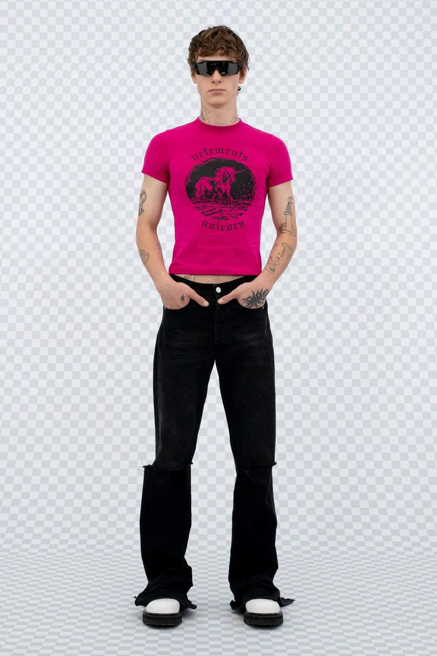 A Man In A Pink Shirt And Black Pants