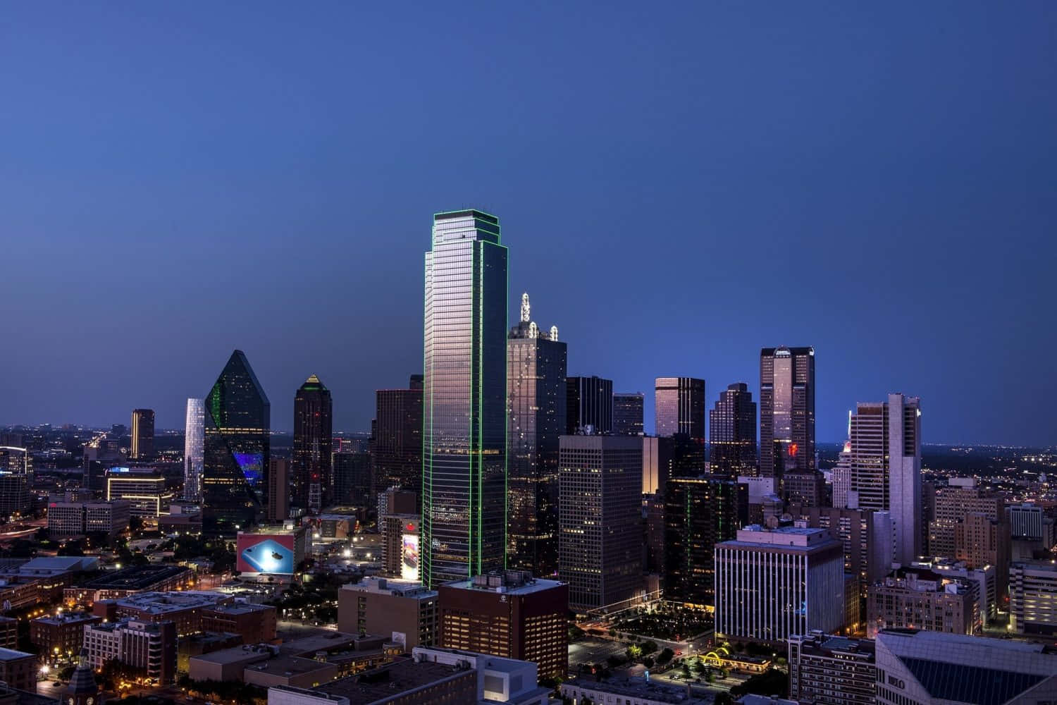 Vibrant Dallas Skyline At Sunset Wallpaper