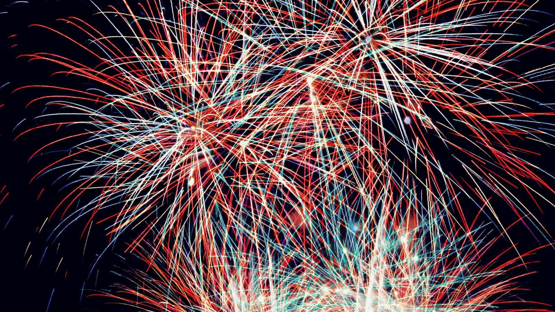 Vibrant July Fireworks Display Wallpaper