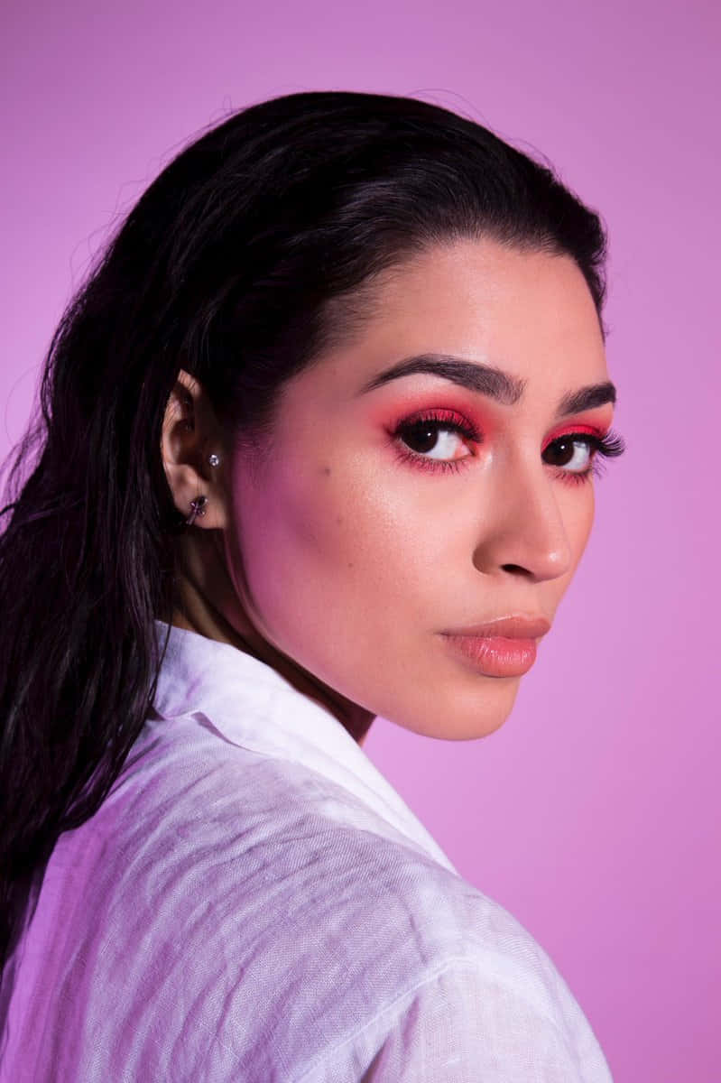 Vibrant Makeup Portrait Pink Backdrop Wallpaper