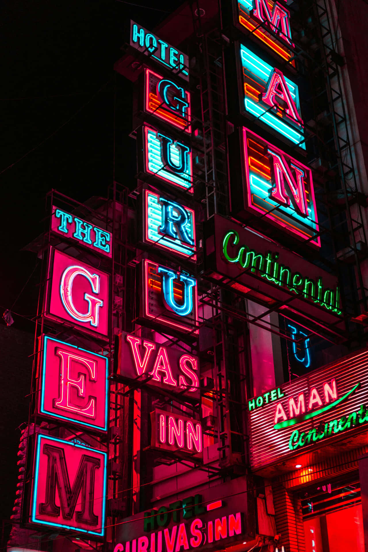 Vibrant_ Neon_ Signs_ Hotel_ Facades Wallpaper