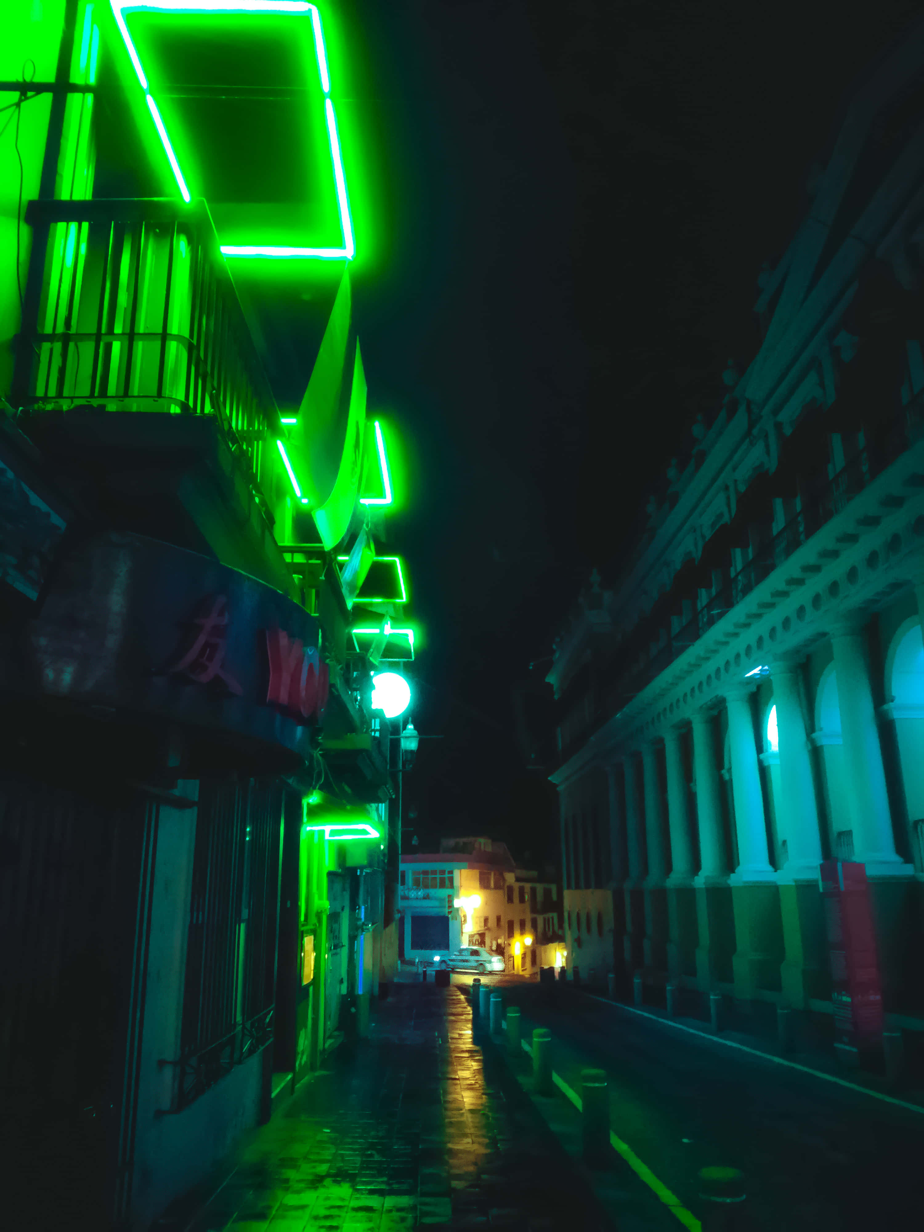 Vibrant Neon Streetscape At Night Wallpaper